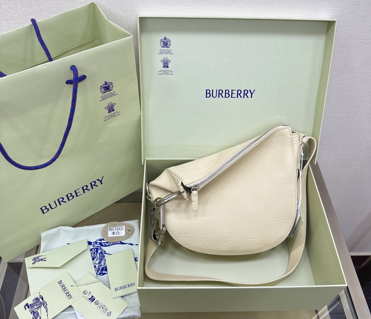 Burberry Small Knight Asymmetric Leather Shoulder Bag - Hunter - 70% Off | Editorialist