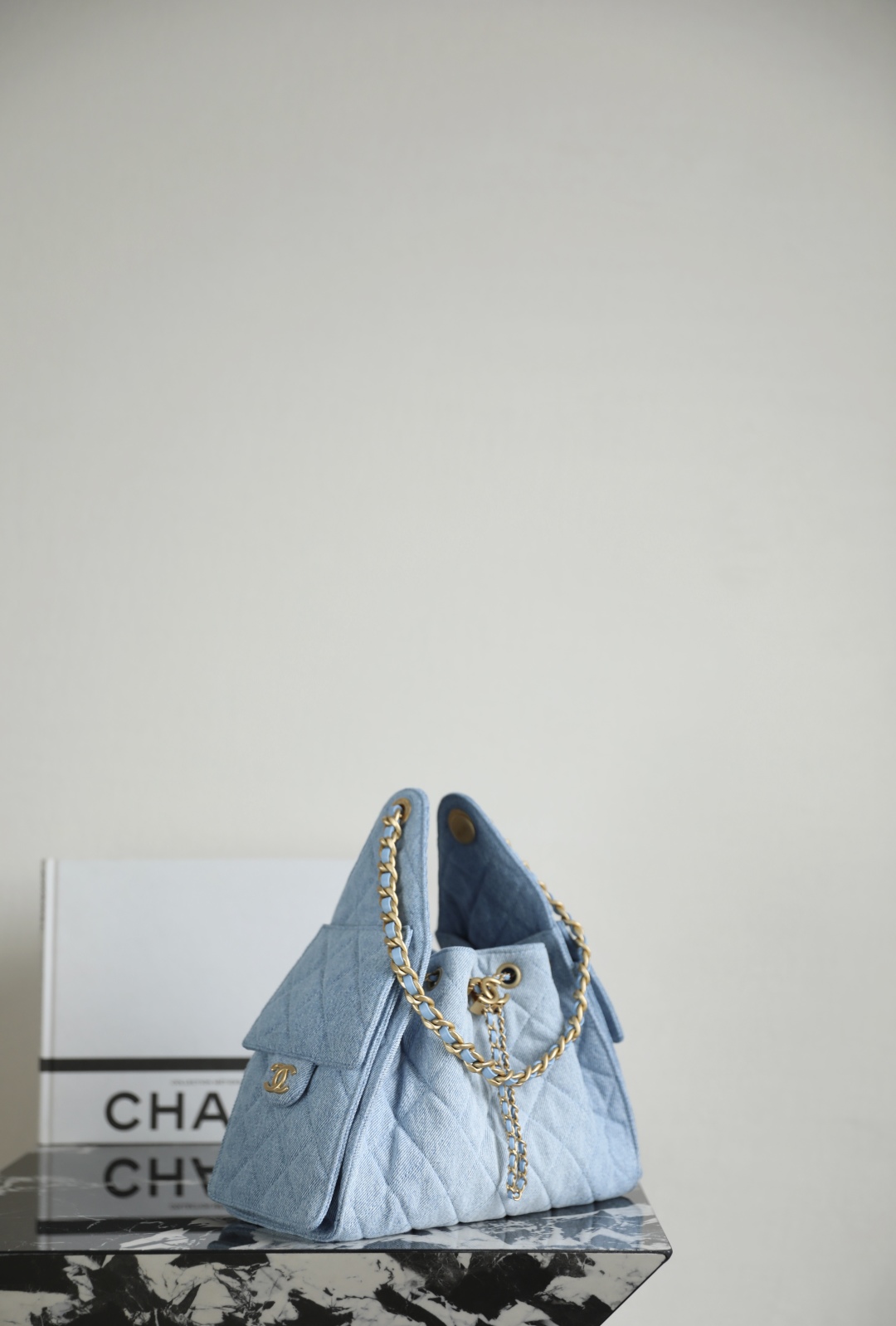 Chanel Chanel 25 small handbag, Washed denim & gold-tone