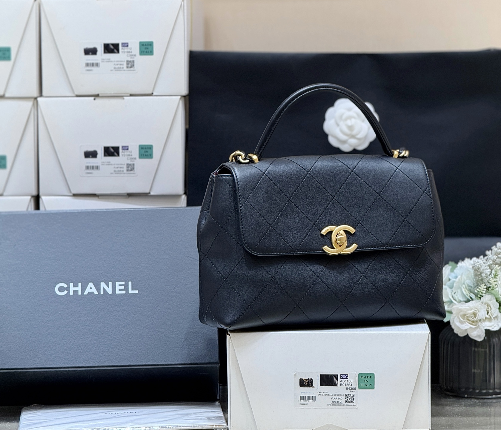 Chanel Large flap bag with top handle, Calfskin & gold-tone metal, black