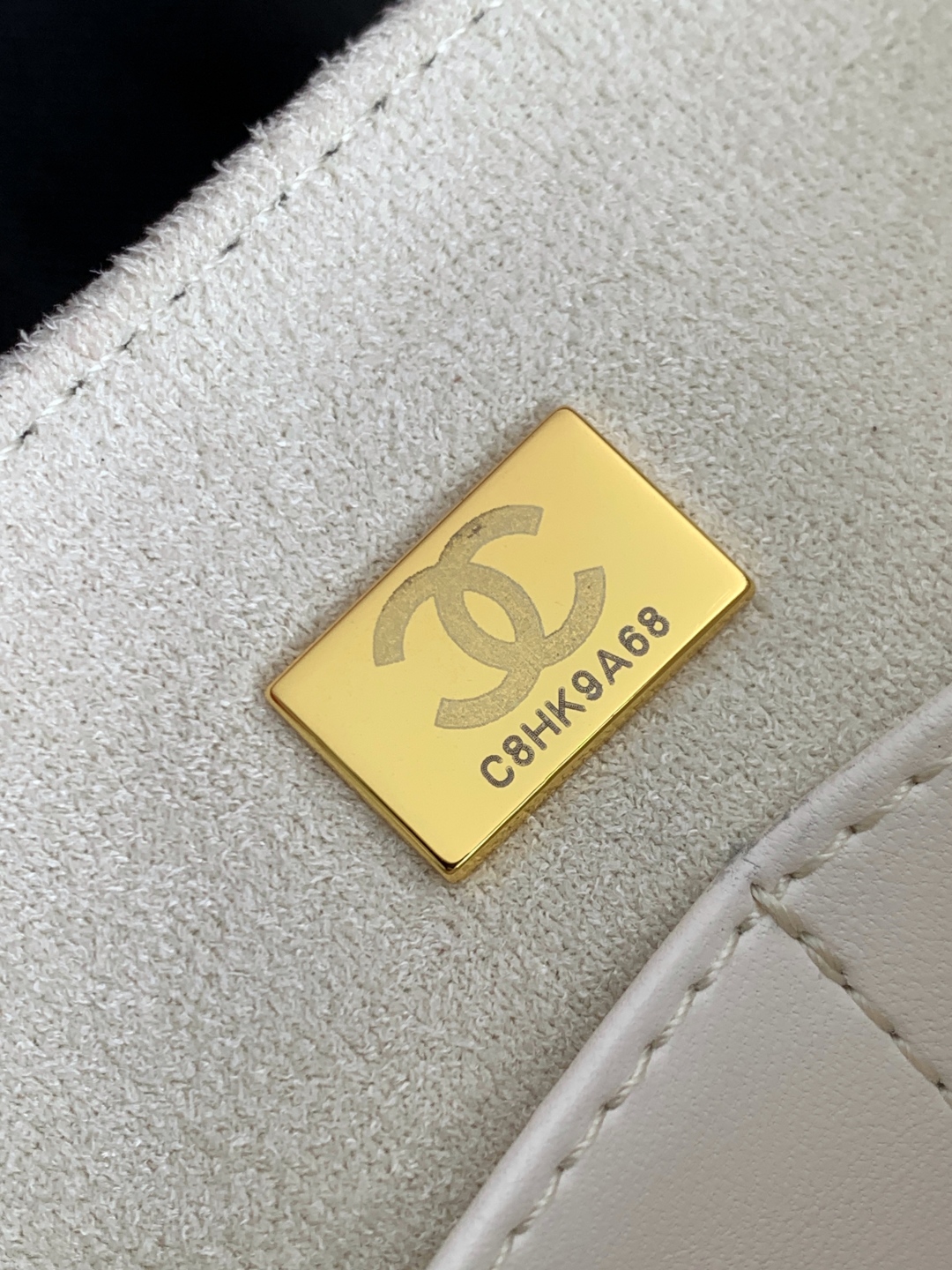 Chanel Maxi flap bag with top handle, Calfskin & gold-tone metal, white