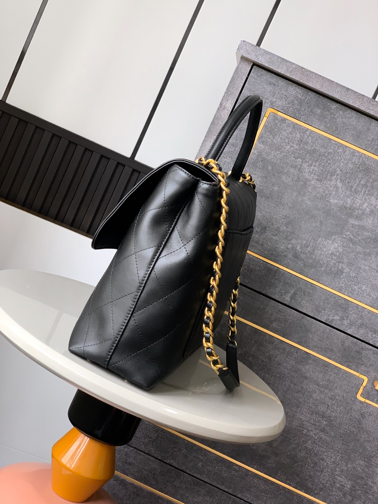 Chanel Maxi flap bag with top handle, Calfskin & gold-tone metal,black