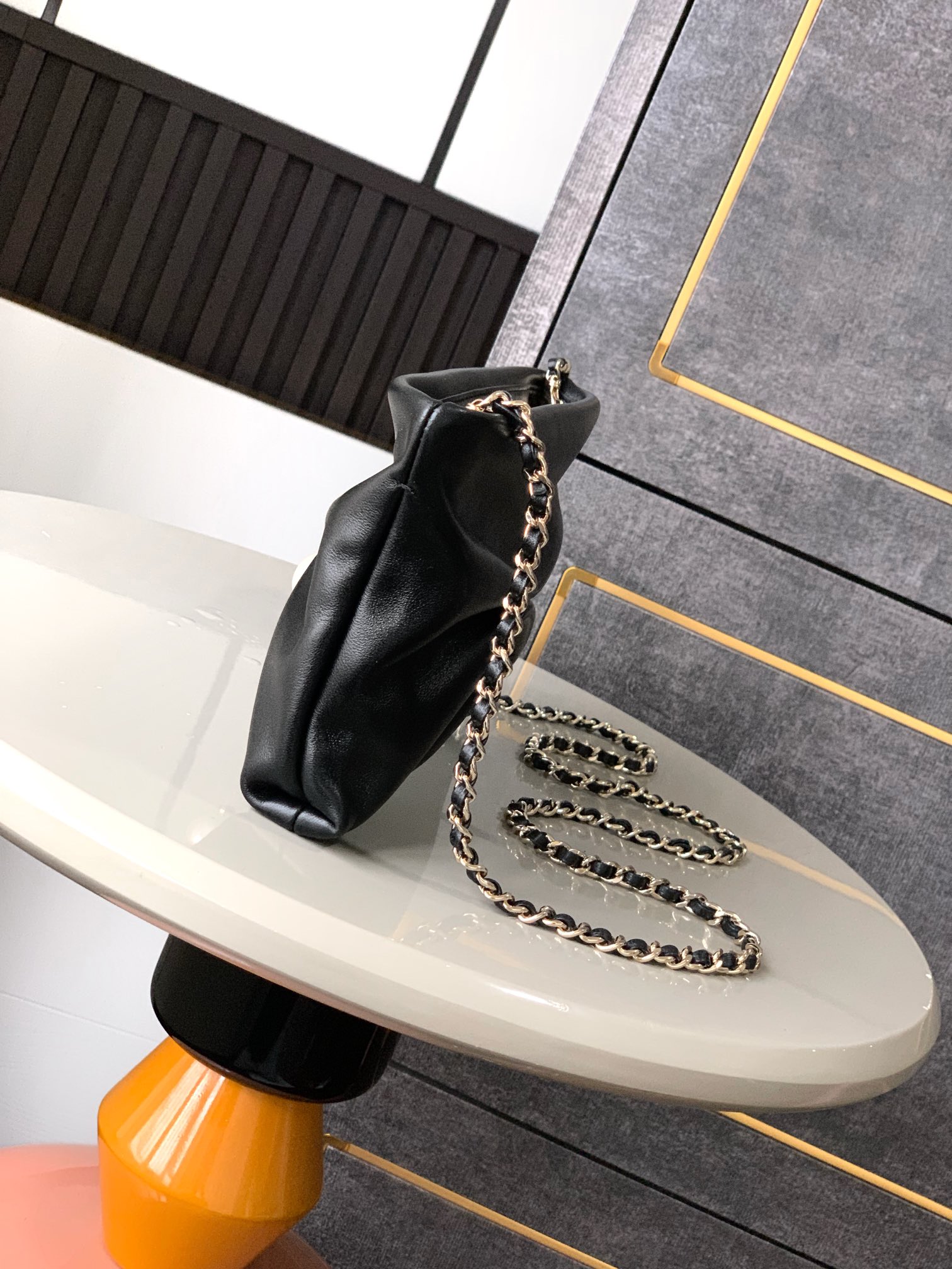 Chanel Maxi flap bag with top handle, Calfskin & gold-tone metal,black