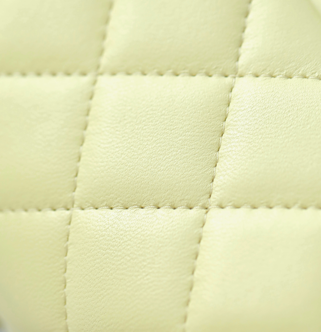 Chanel Mini classic handbag, Lambskin & gold-tone metal, light yellow