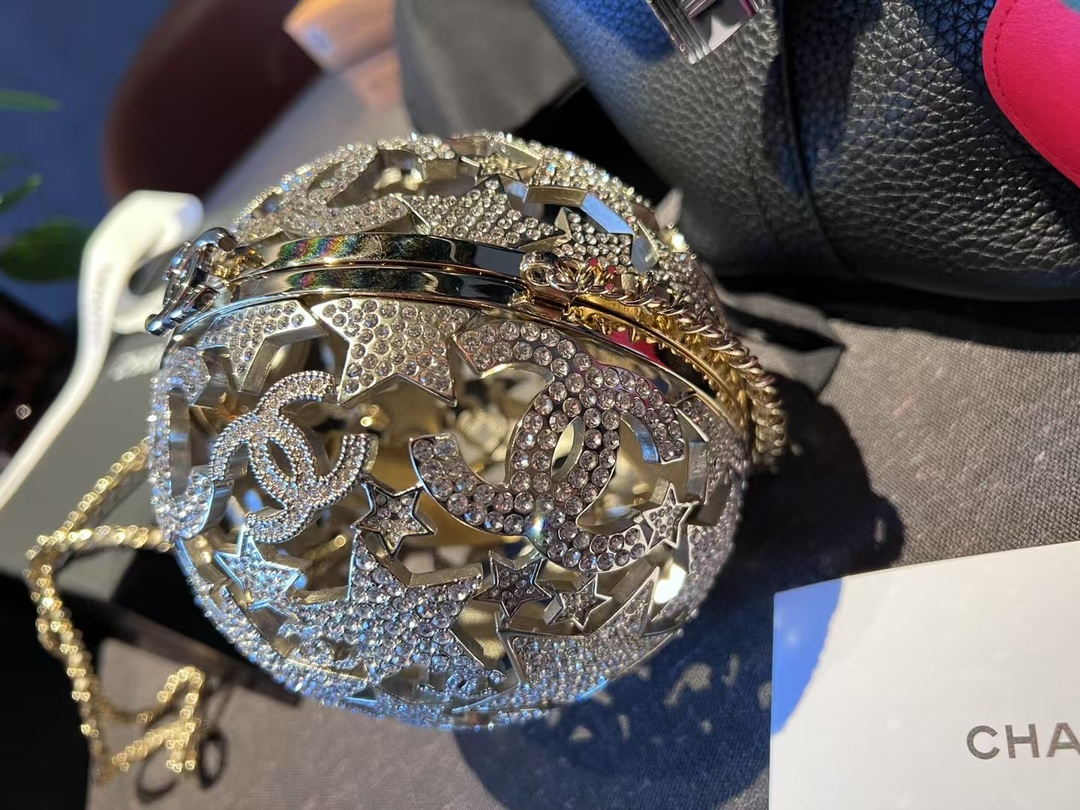 Chanel Sphere minaudiere, Gold-tone metal & strass, golden & crystal