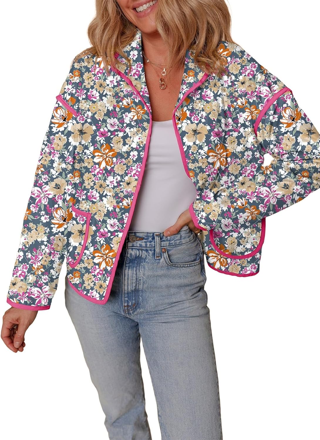 Bright floral blazer jacket with pink trim, perfect for spring and summer styles.