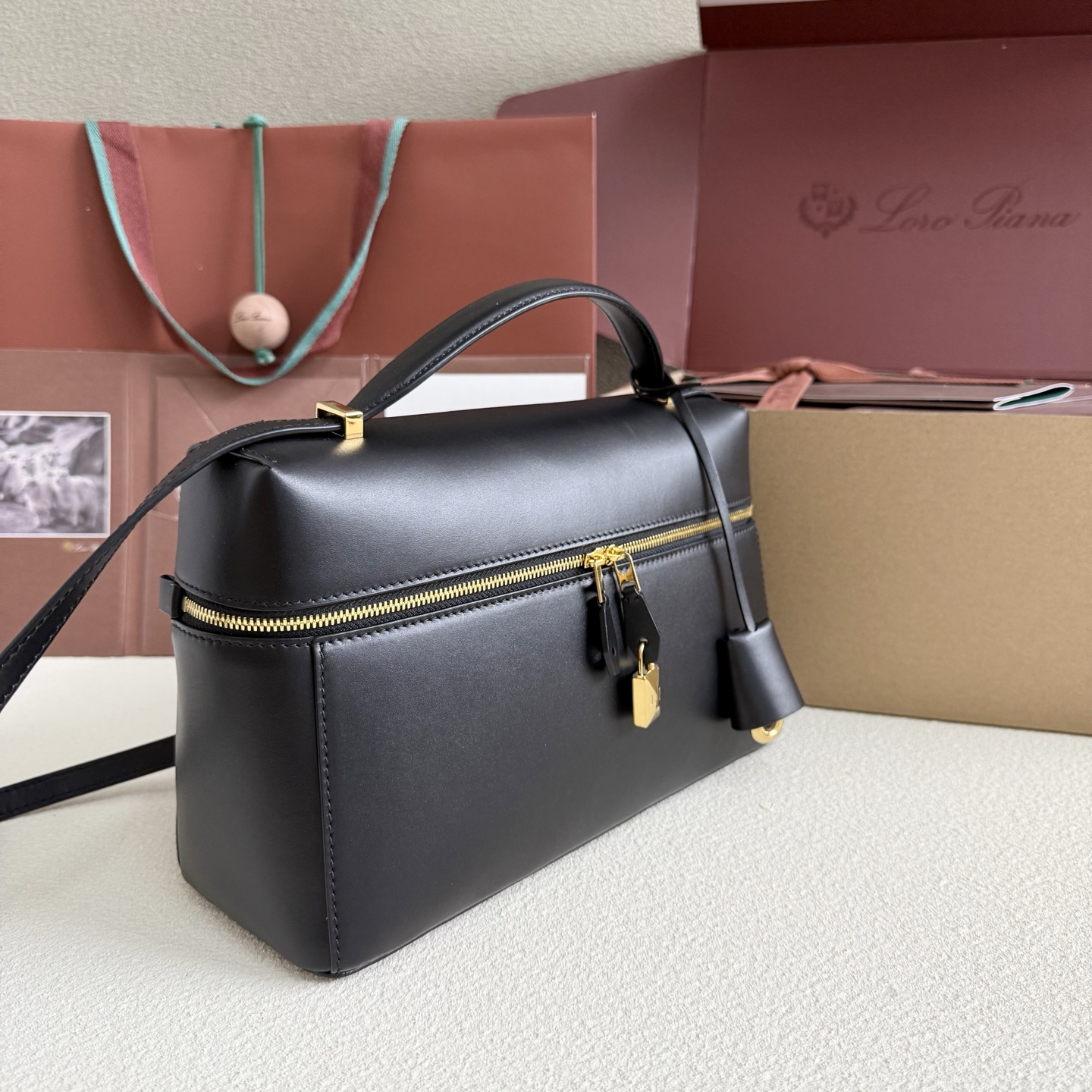 Extra L27 leather crossbody bag in black - Loro Piana |