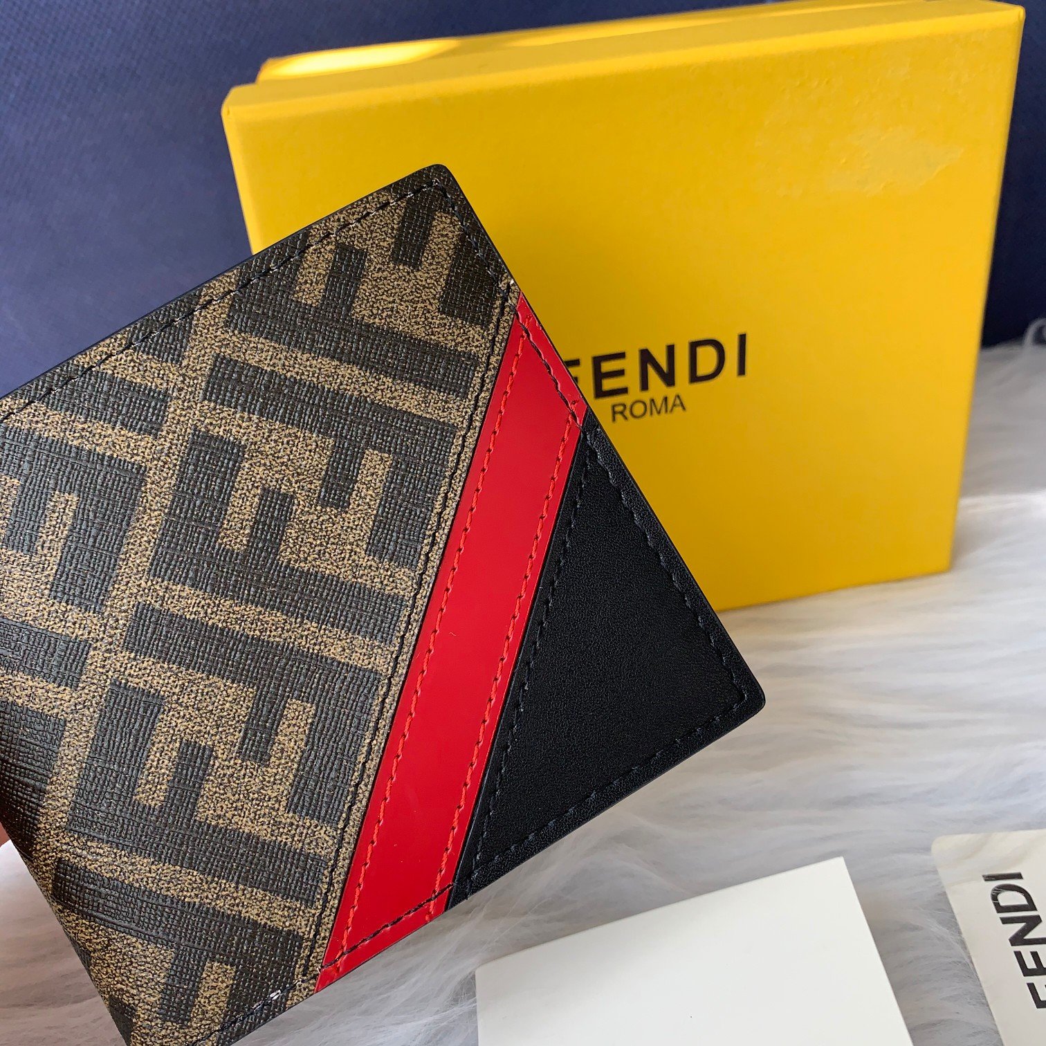 Fendi wallet, possibly a men's wallet with Fendi's signature FF monogram and a red and black diagonal stripe