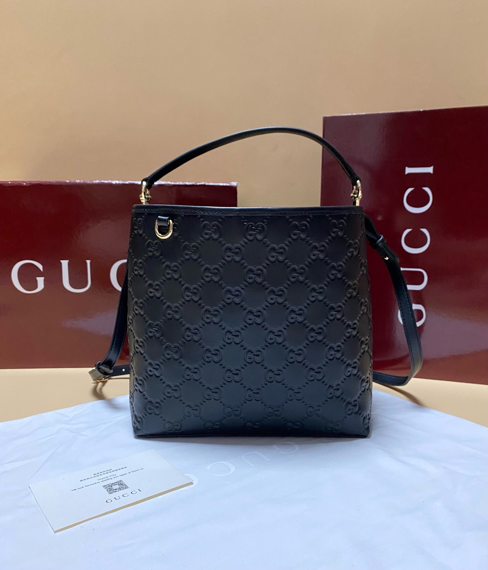 GG Emblem small bucket bag in Black Leather