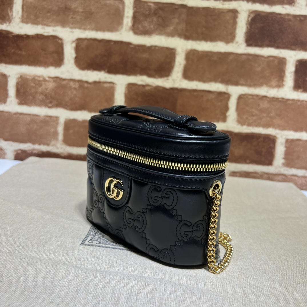 GG Matelassé top handle mini bag in black leather | GUCCI
