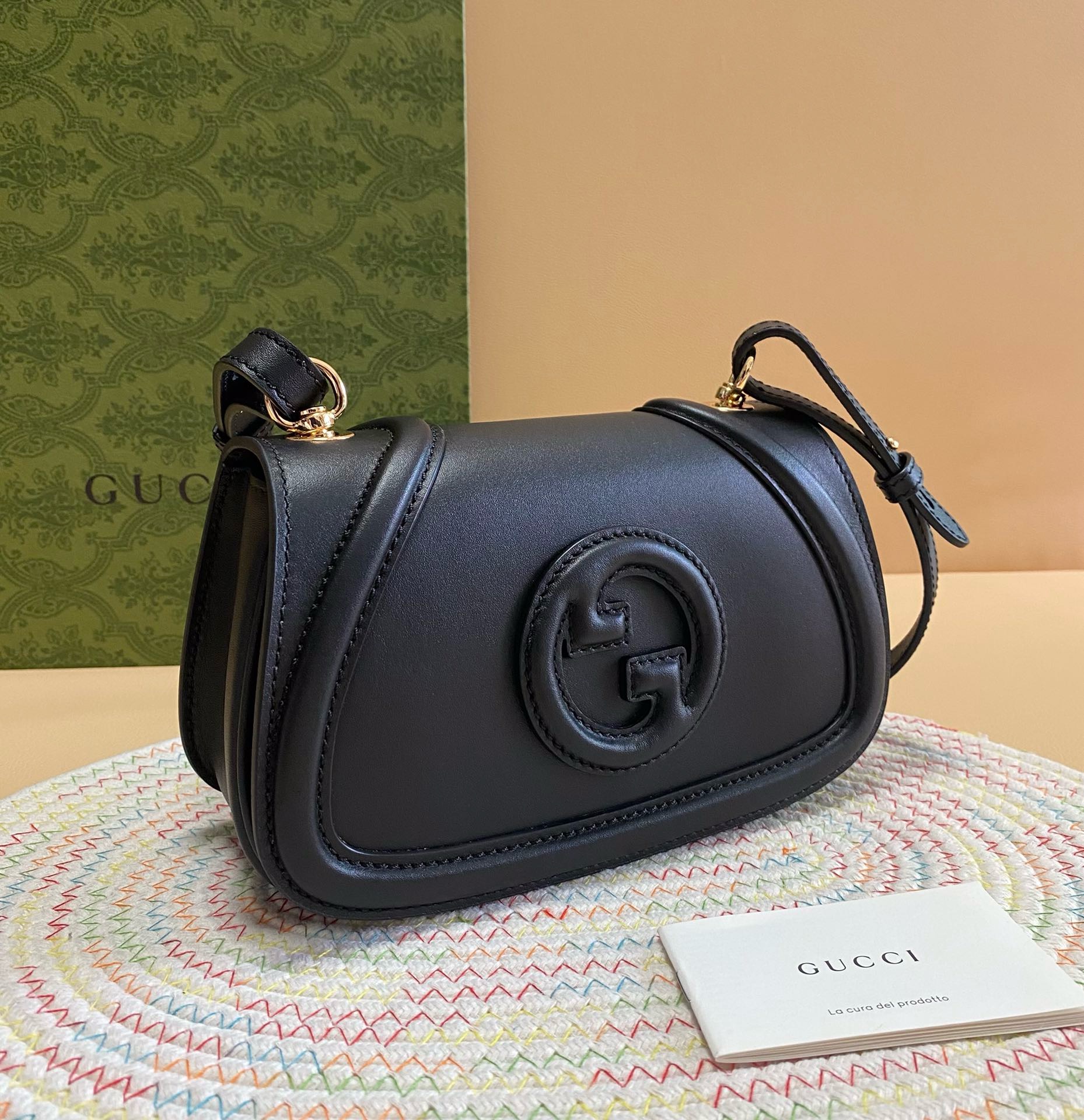 Gucci Black Blondie Shoulder Bag with interlocking G logo on smooth black leather, gold hardware, and care card.
