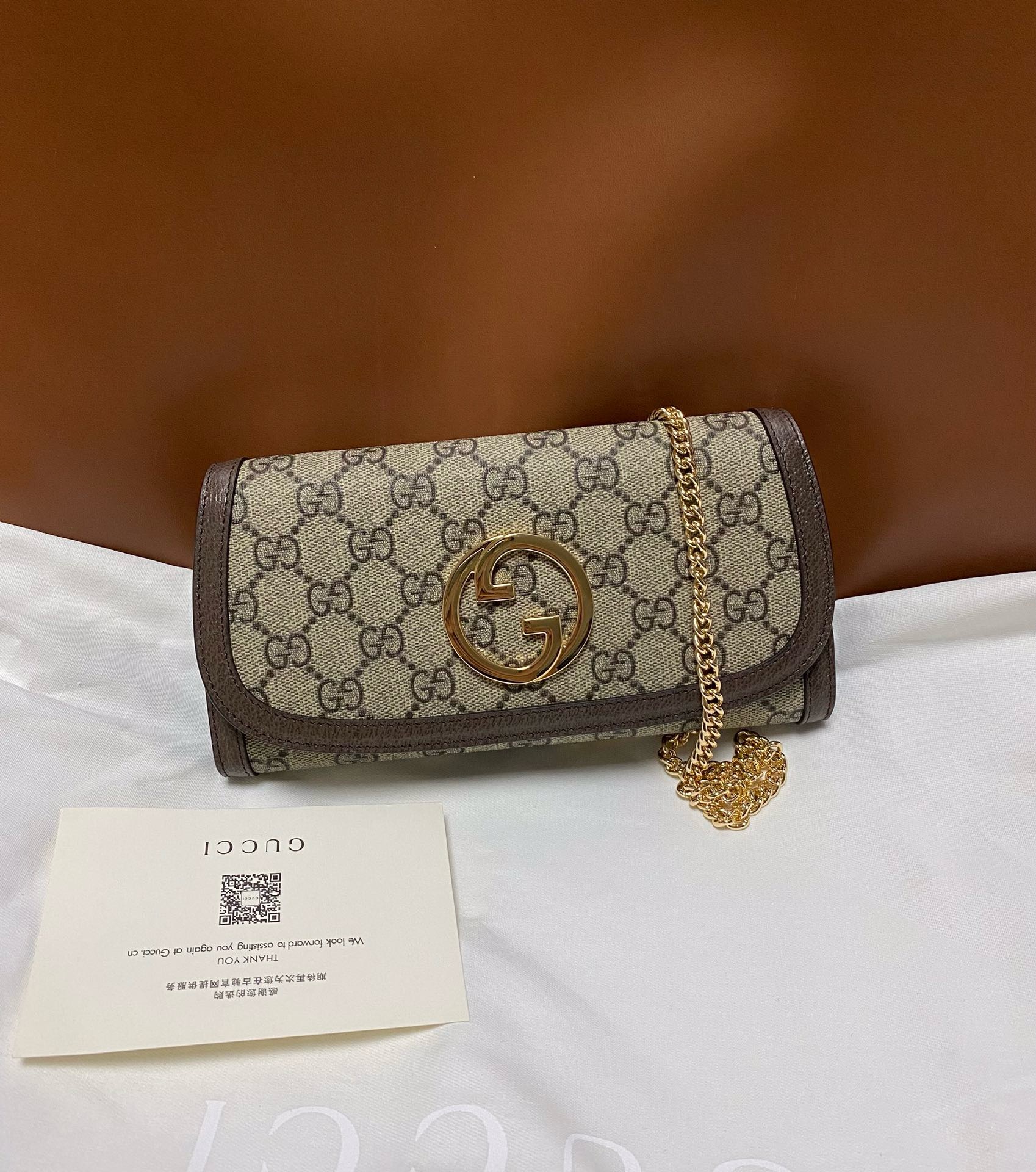 Gucci Ophidia Chain Crossbody bag in GG Supreme canvas with gold Interlocking G logo