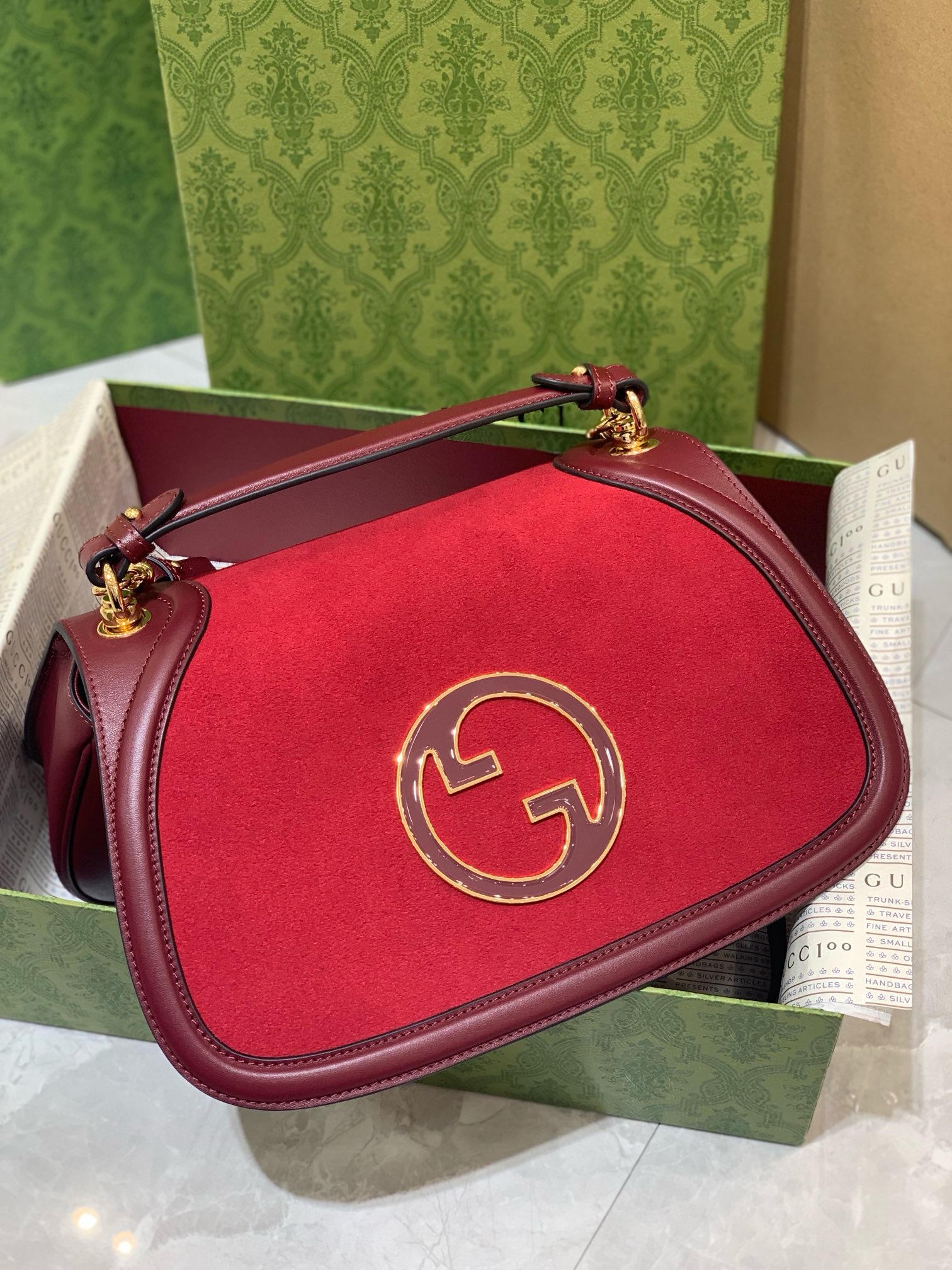 Gucci Blondie Red Suede Bag with iconic GG logo and leather trim, luxury handbag.