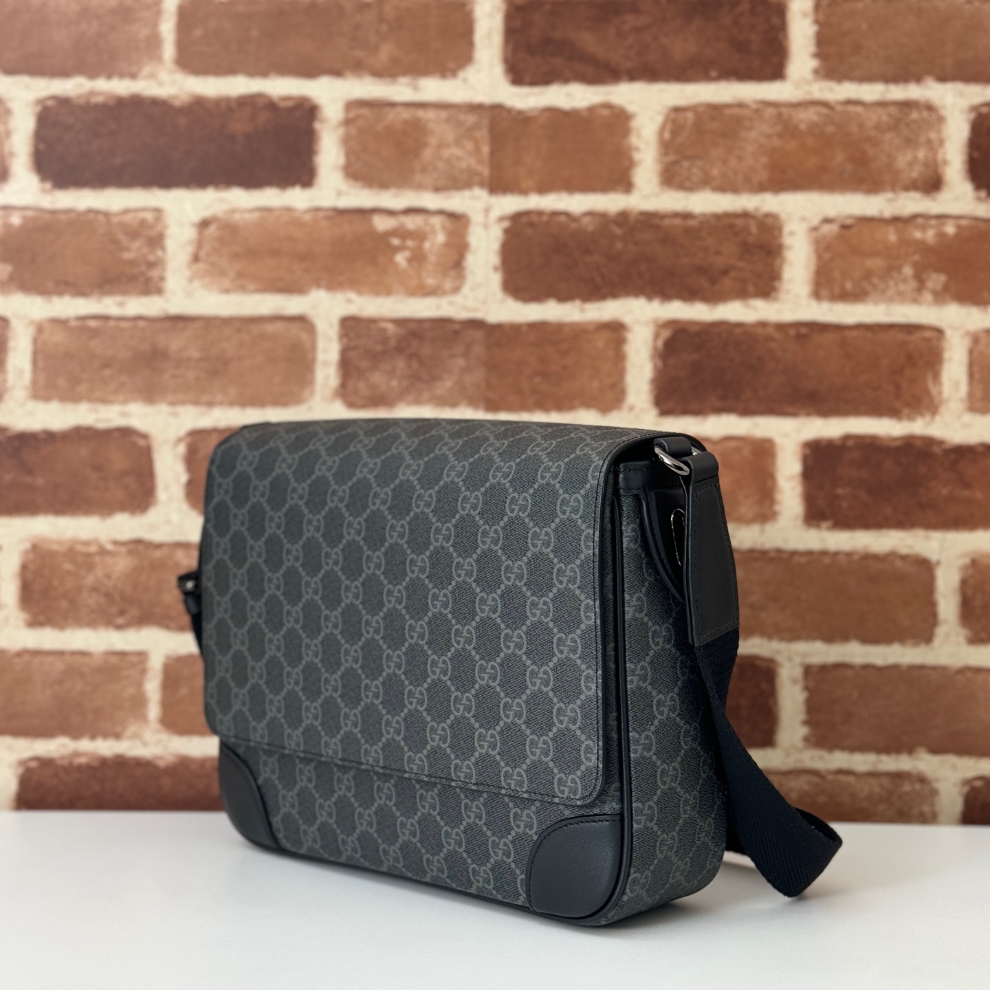 Gucci GG Emblem medium crossbody bag in black fabric | GUCCI®