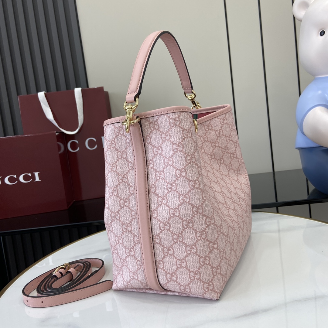 Gucci GG Emblem small bucket bag in light pink coated fabric