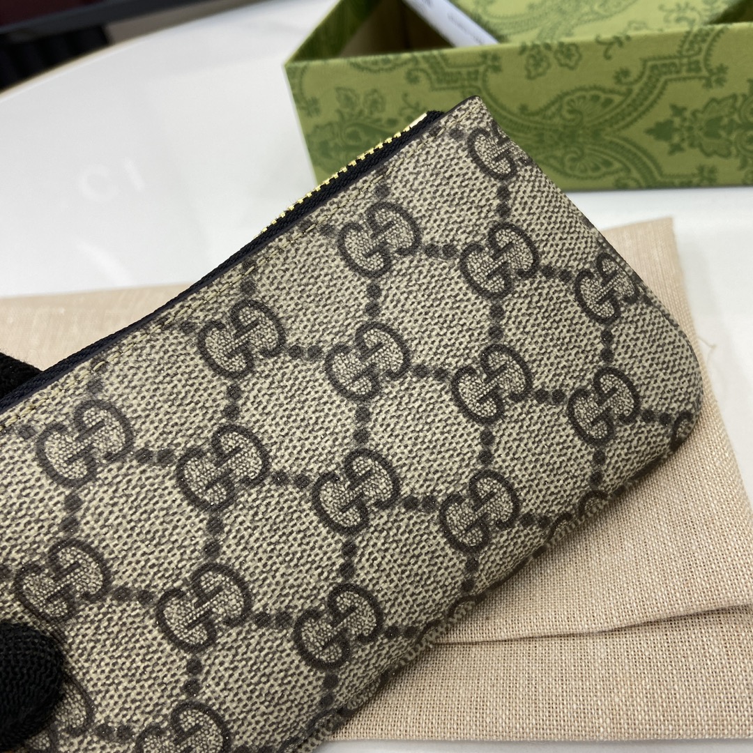 Gucci GG key case with dog detail in beige and dark brown fabric