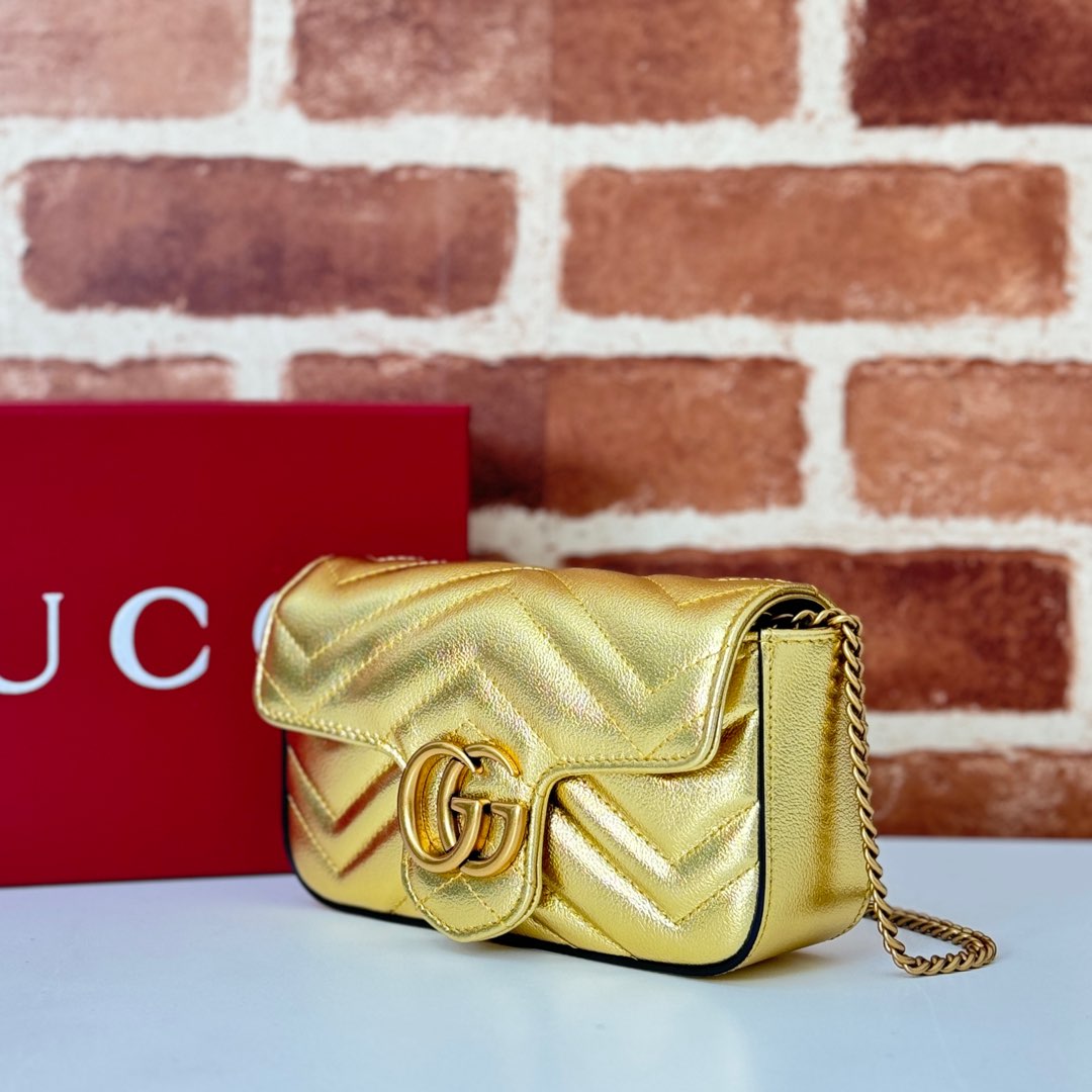 Gucci GG Marmont mini bag in Silver gold Leather | GUCCI