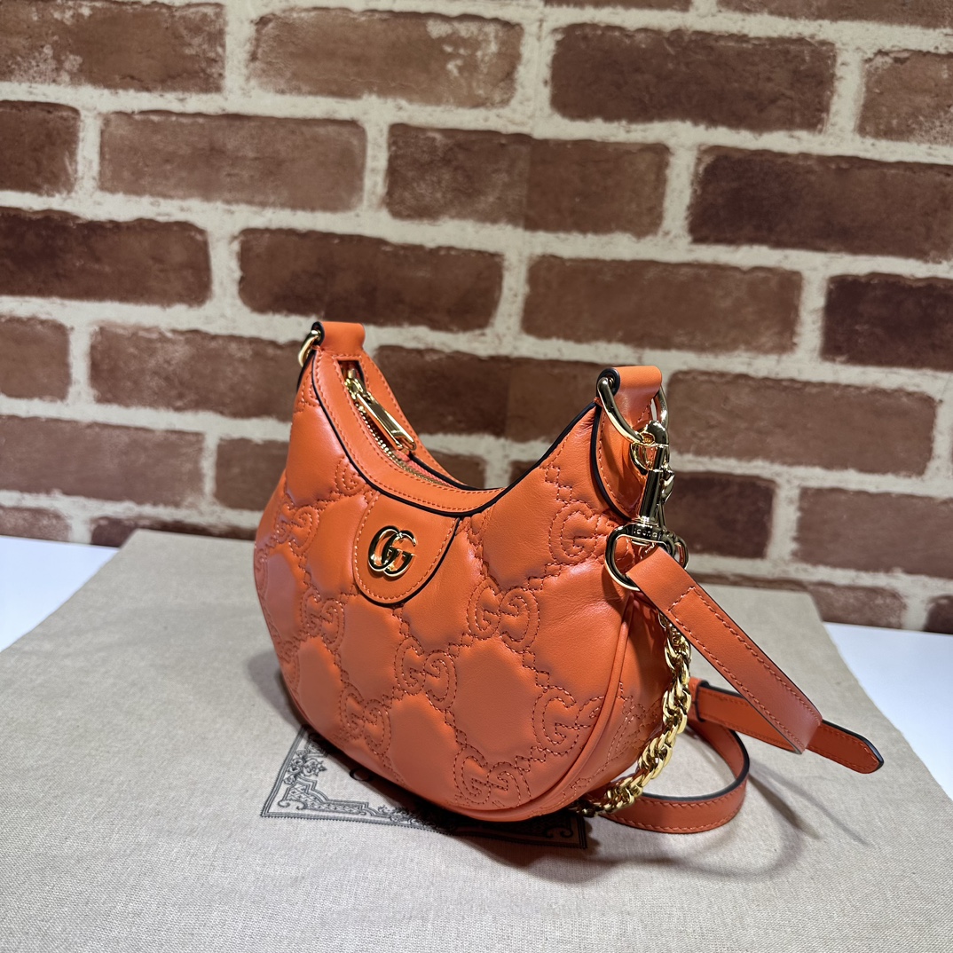 Gucci GG Matelassé small shoulder bag in orange leather | GUCCI