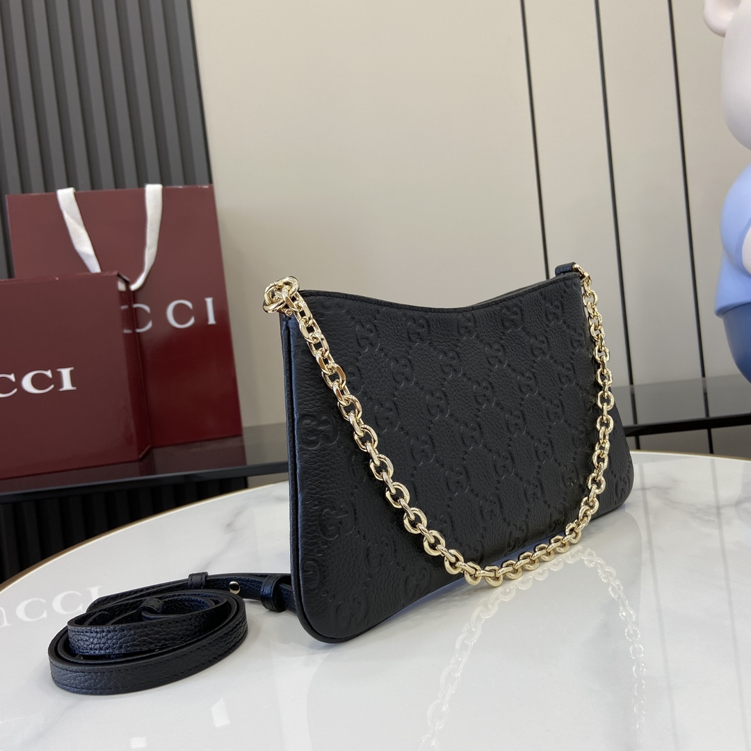 Gucci GG Mini debossed leather shoulder bag in black - Gucci