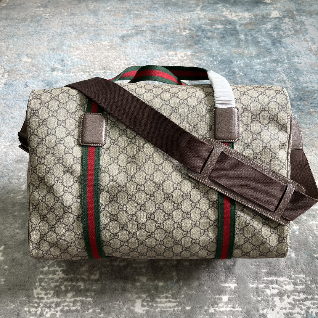 Gucci Savoy medium duffle bag in Beige GG Canvas | GUCCI