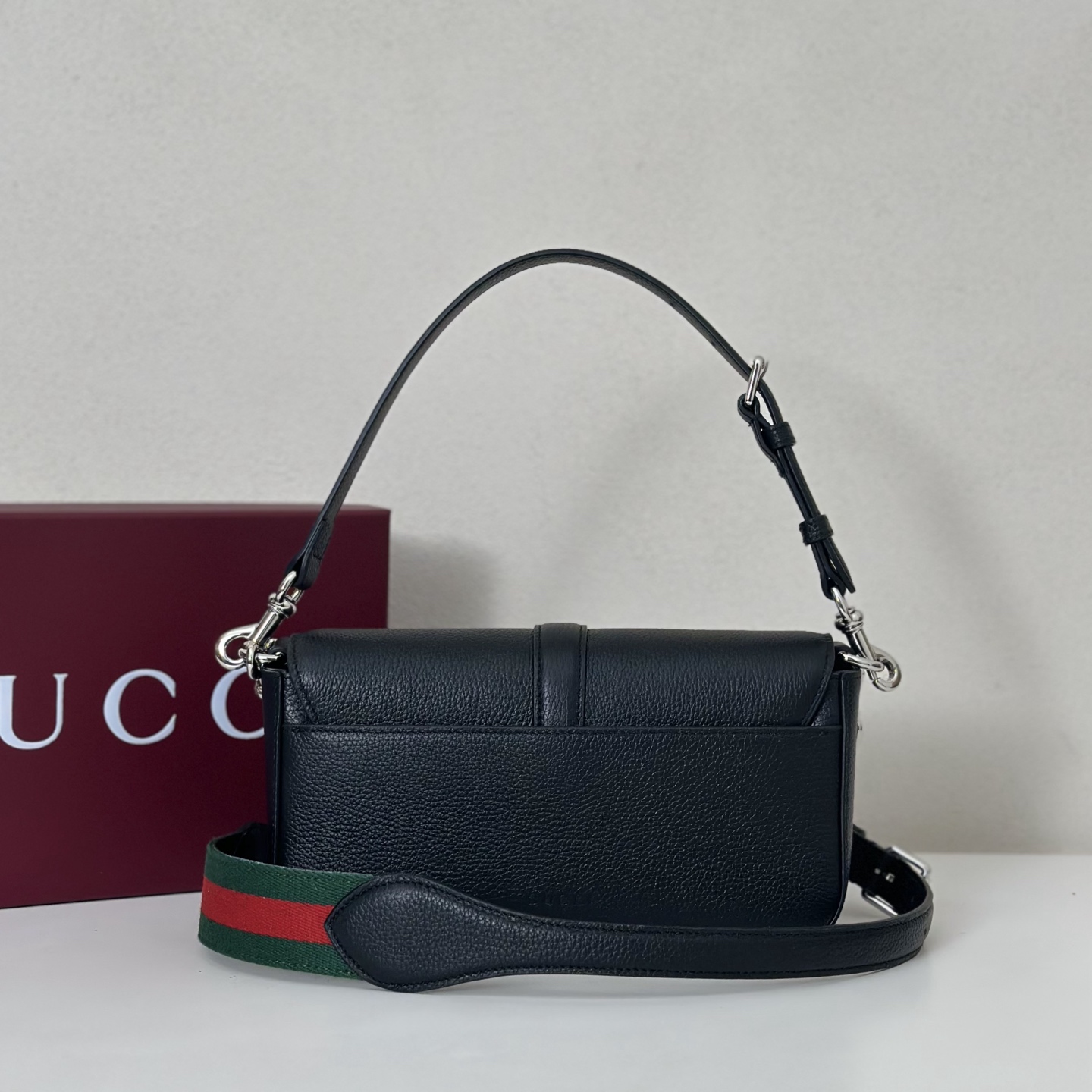 Gucci Small crossbody bag with hook closure in black leather