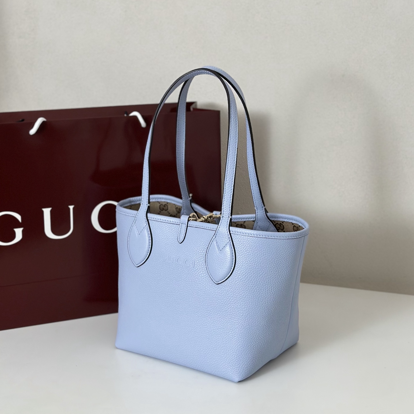 Gucci Totissima small reversible tote bag in light blue leather