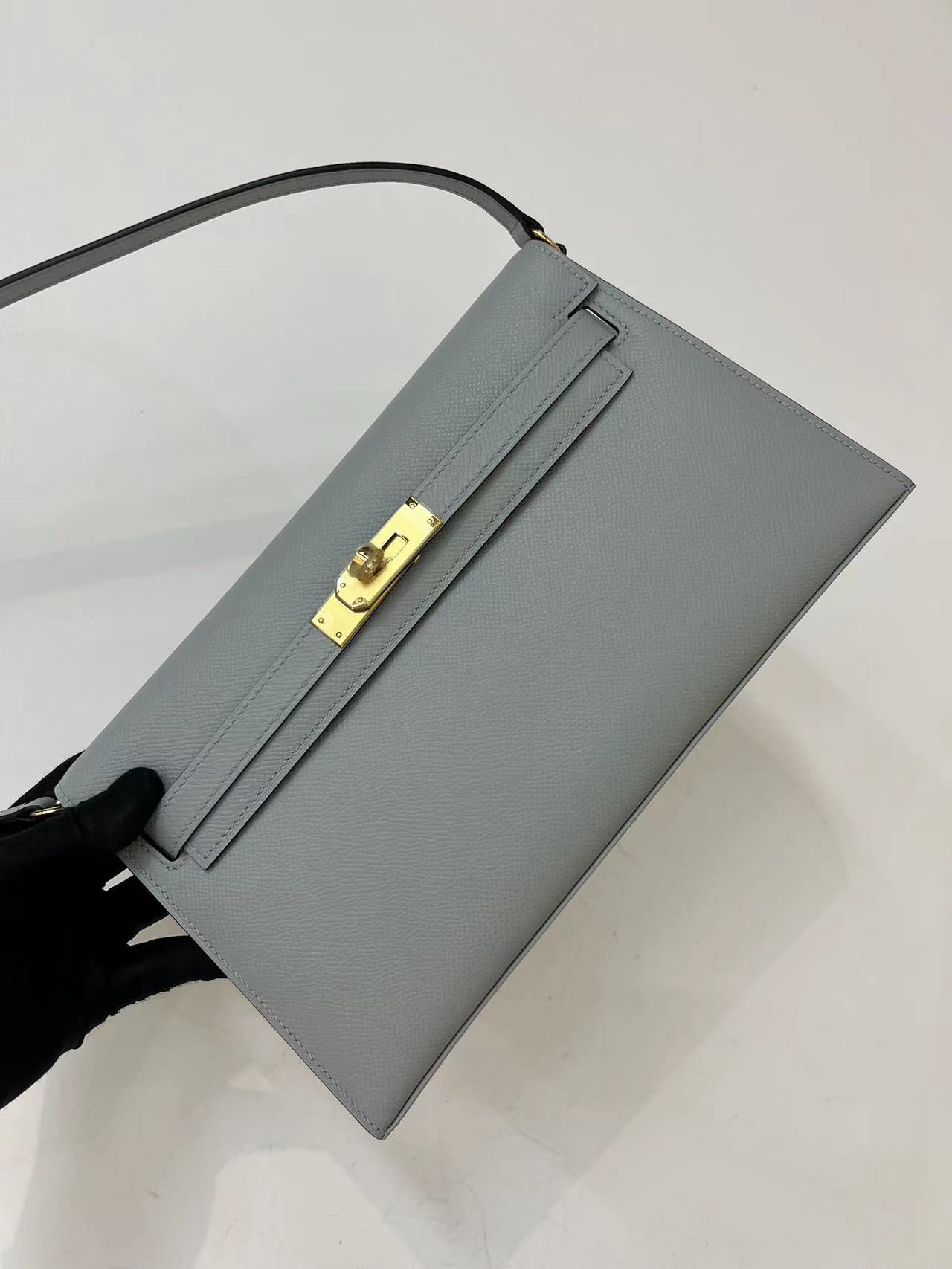 Hermès Kelly Grey Clutch - Gold Hardware, Timeless Style