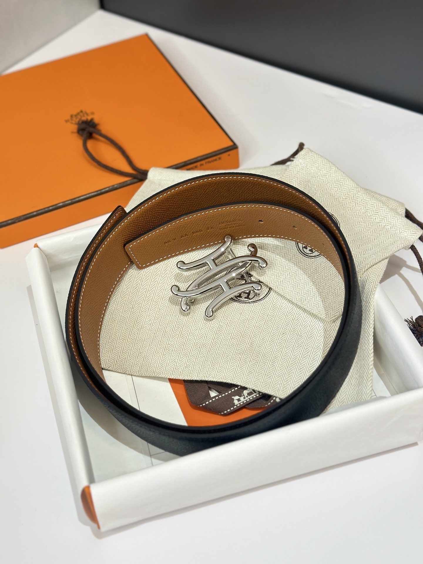 Luxury Hermès Reversible Leather Belt - Black & Tan with Silver Buckle