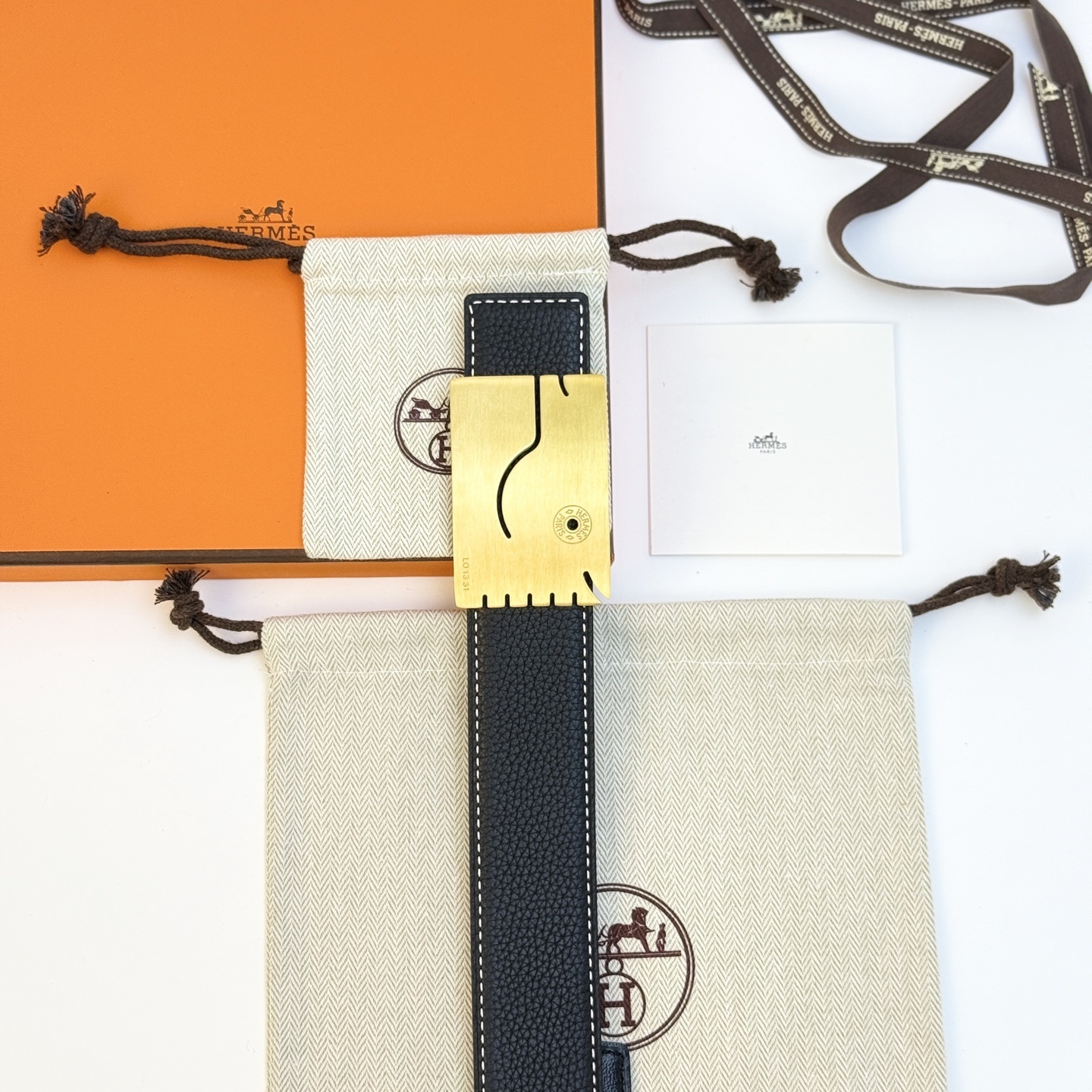 Hermès Men's Black Leather Belt with Unique Brushed Gold Buckle