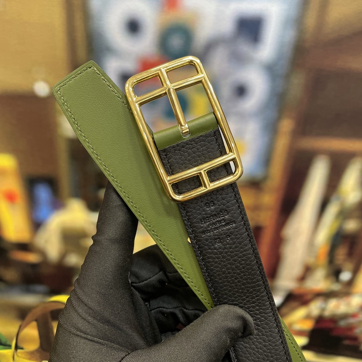 Elegant Designer Leather Belt with Iconic Stirrup Buckle