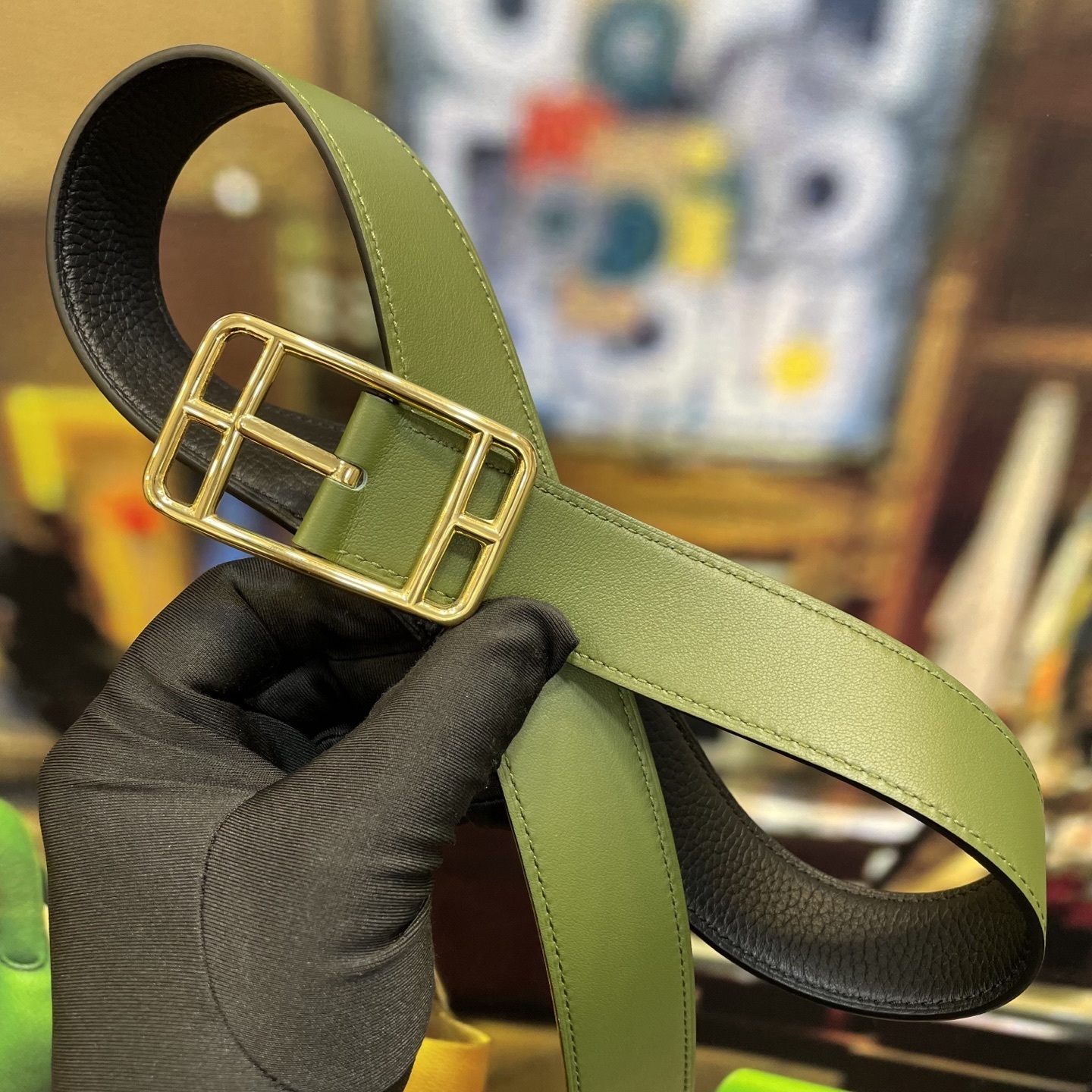 Elegant Designer Leather Belt with Iconic Stirrup Buckle