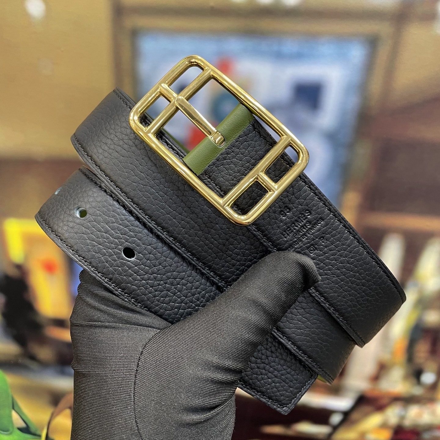 Elegant Designer Leather Belt with Iconic Stirrup Buckle