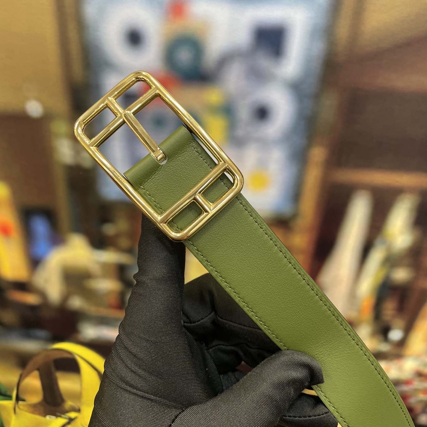 Elegant Designer Leather Belt with Iconic Stirrup Buckle