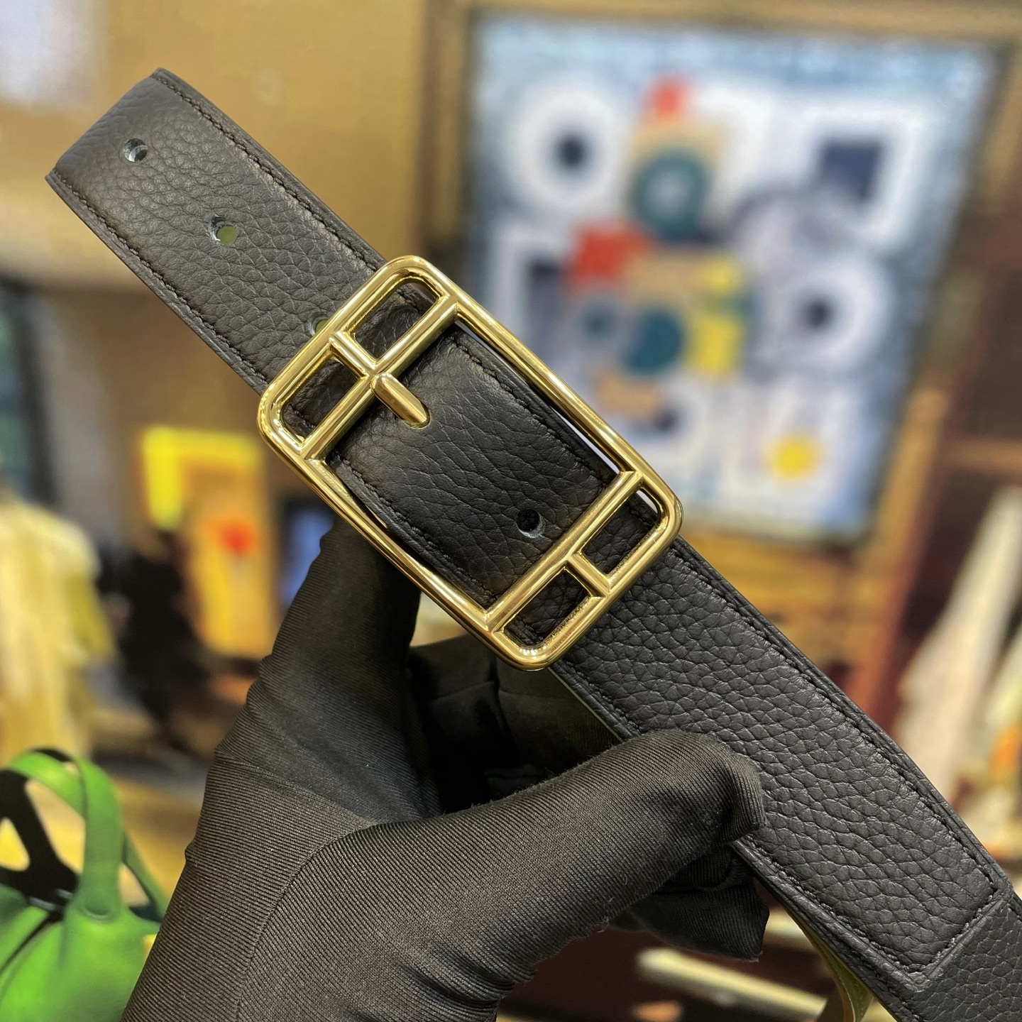 Elegant Designer Leather Belt with Iconic Stirrup Buckle