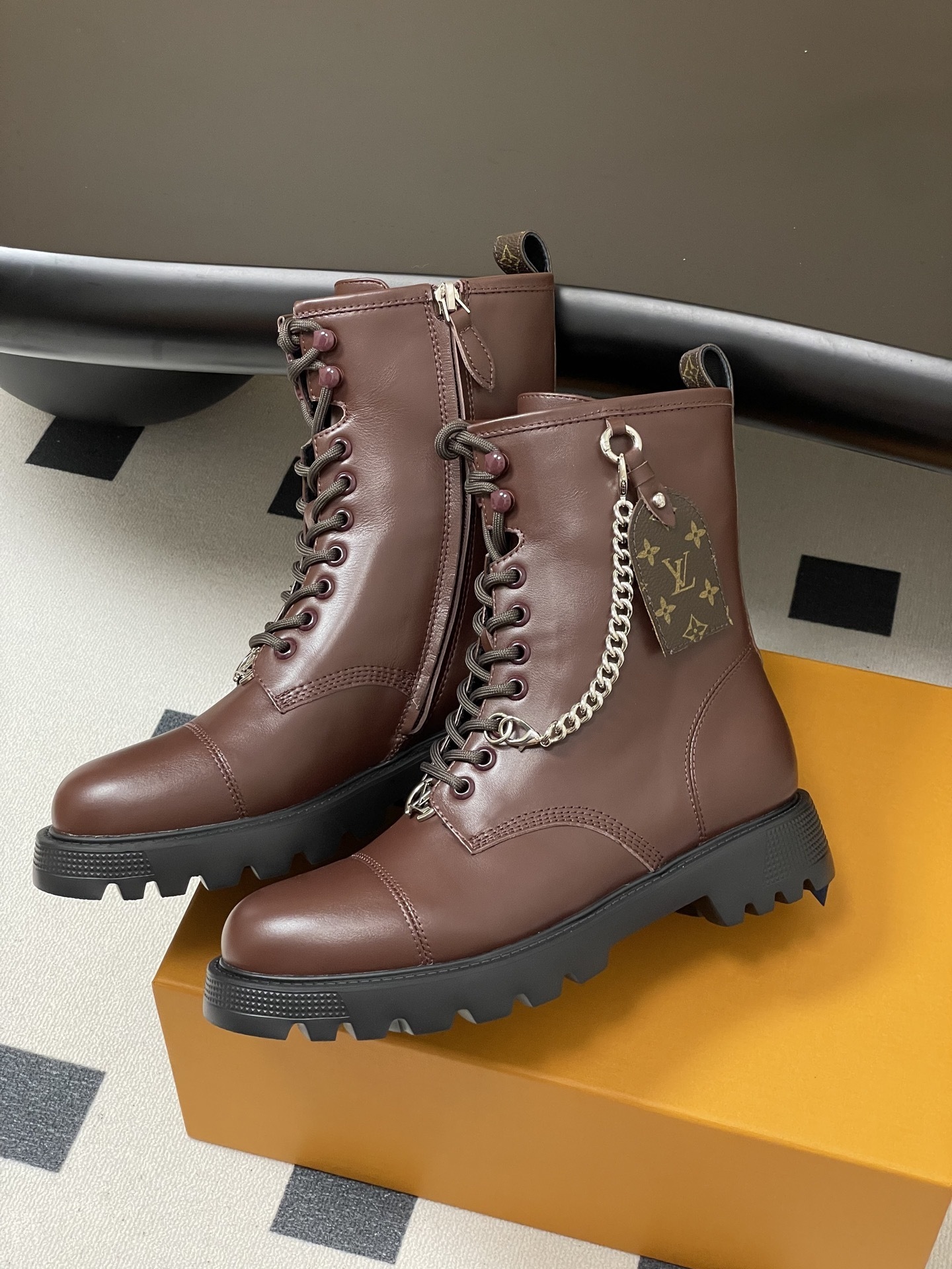 Luxury Brown Leather Combat Boots with Signature Monogram Detail