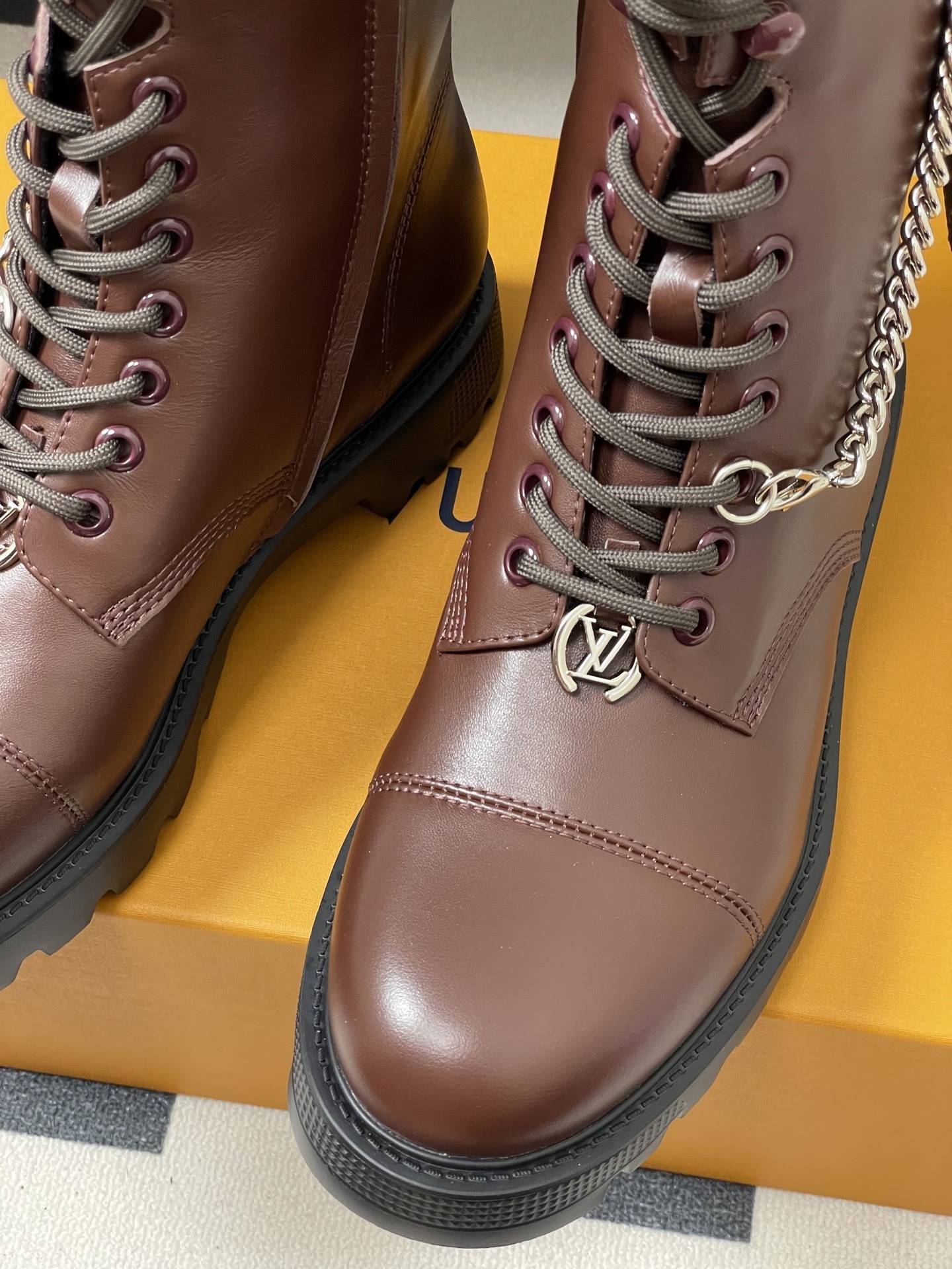 Luxury Brown Leather Combat Boots with Signature Monogram Detail