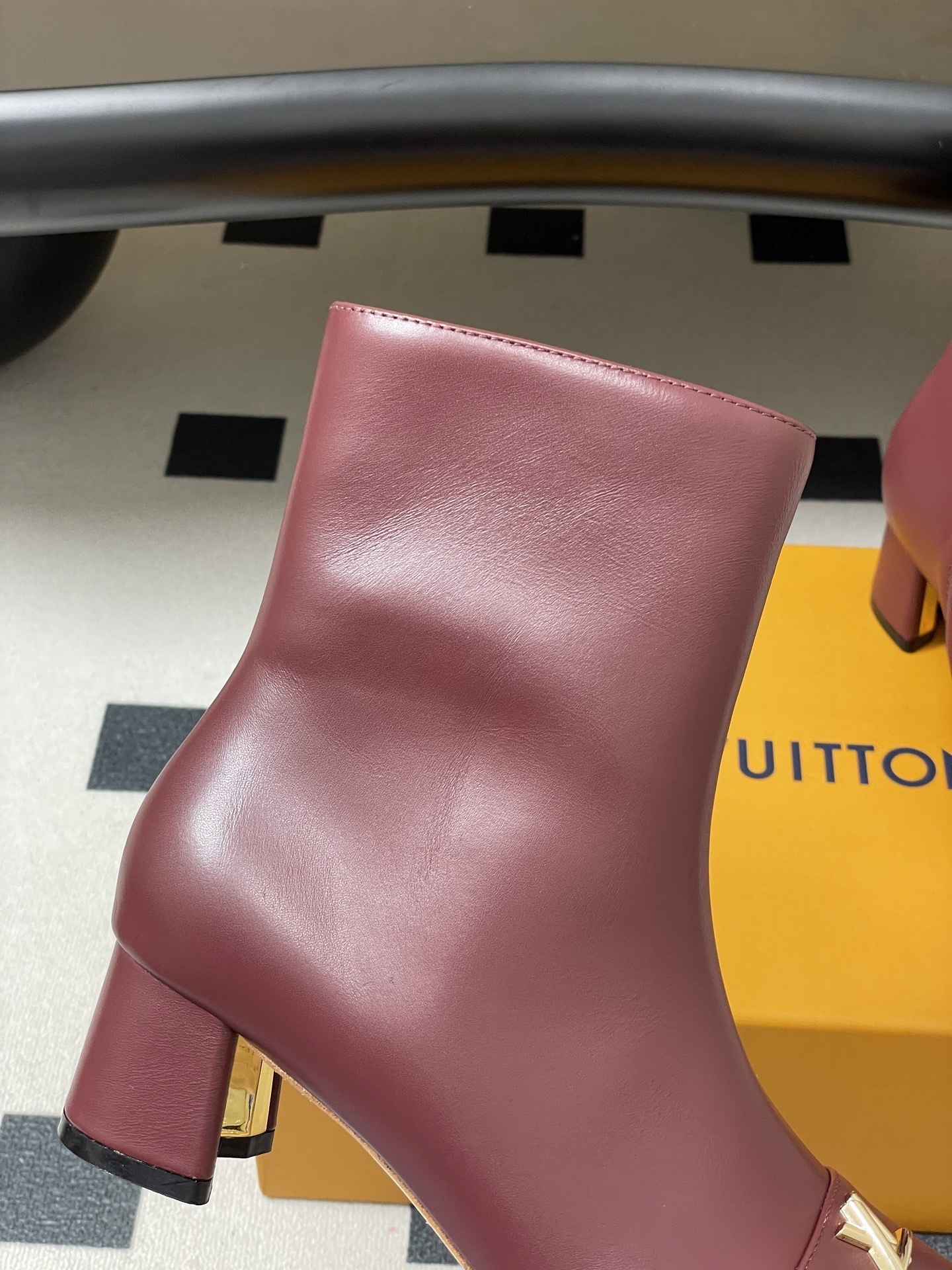 Elegant Burgundy Leather Ankle Boots with Gold LV Logo Ornament