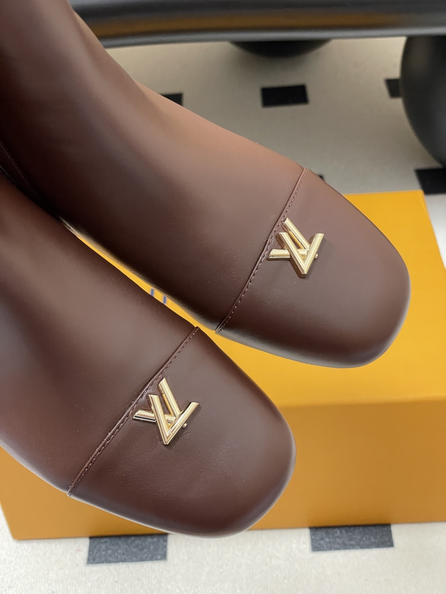 Luxury Brown Leather Ankle Boots with Gold LV Logo Detail