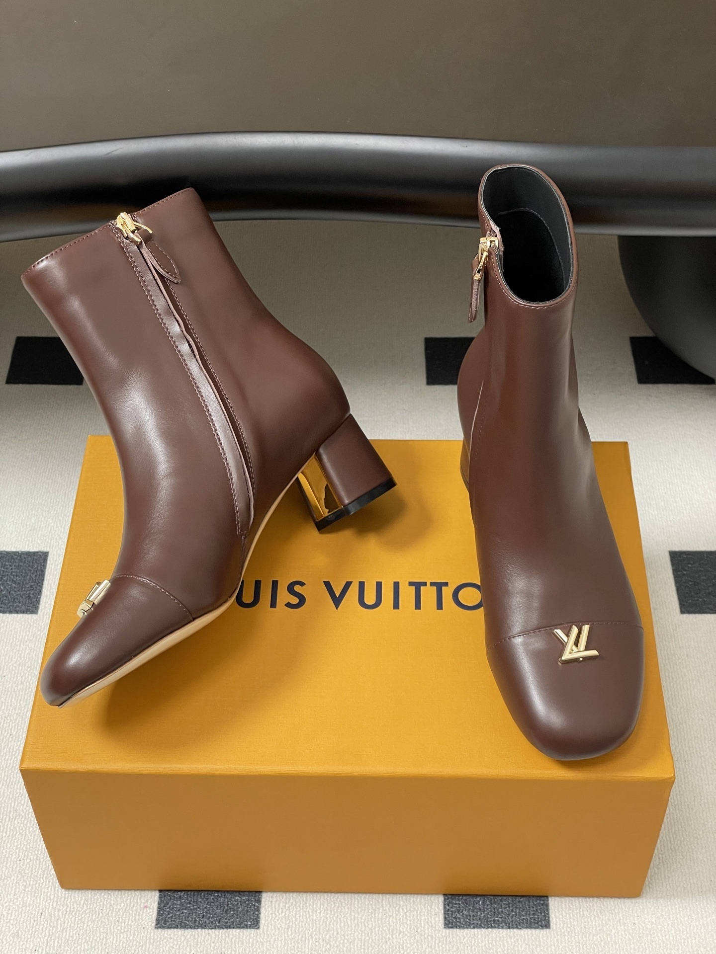 Luxury Brown Leather Ankle Boots with Gold LV Logo Detail