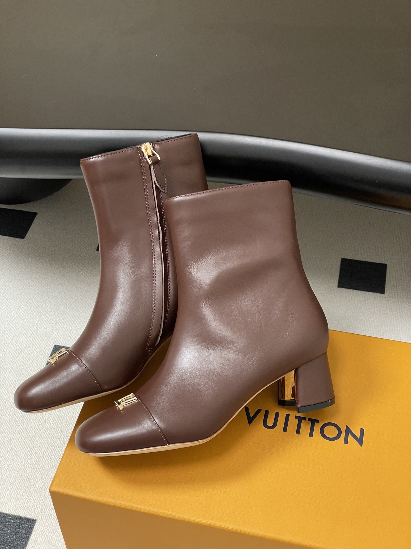 Luxury Brown Leather Ankle Boots with Gold LV Logo Detail