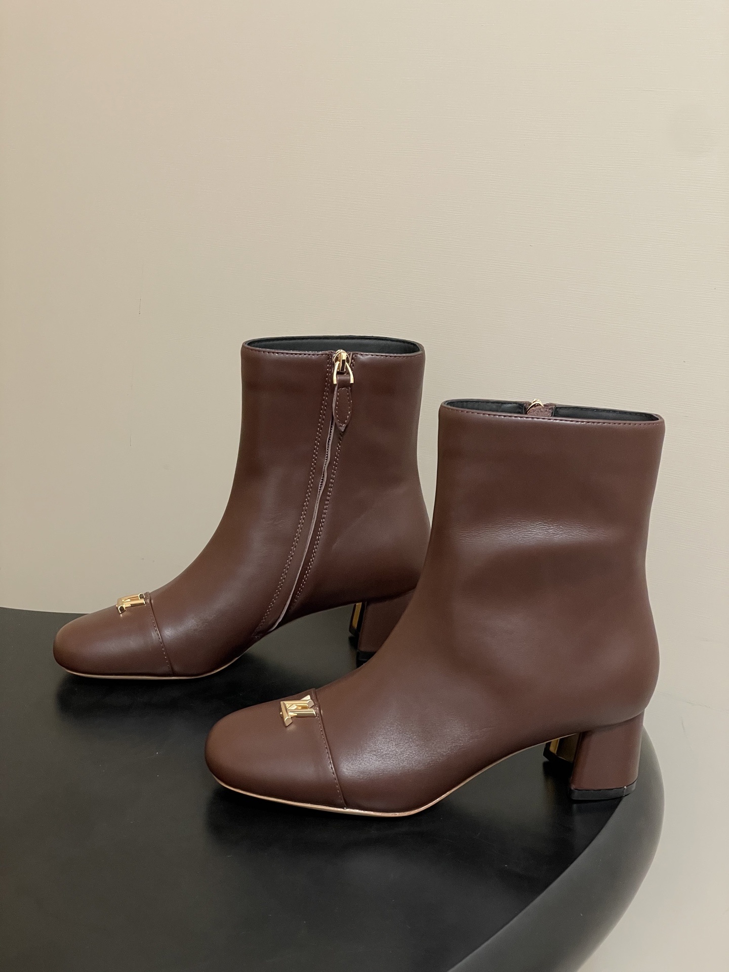 Luxury Brown Leather Ankle Boots with Gold LV Logo Detail