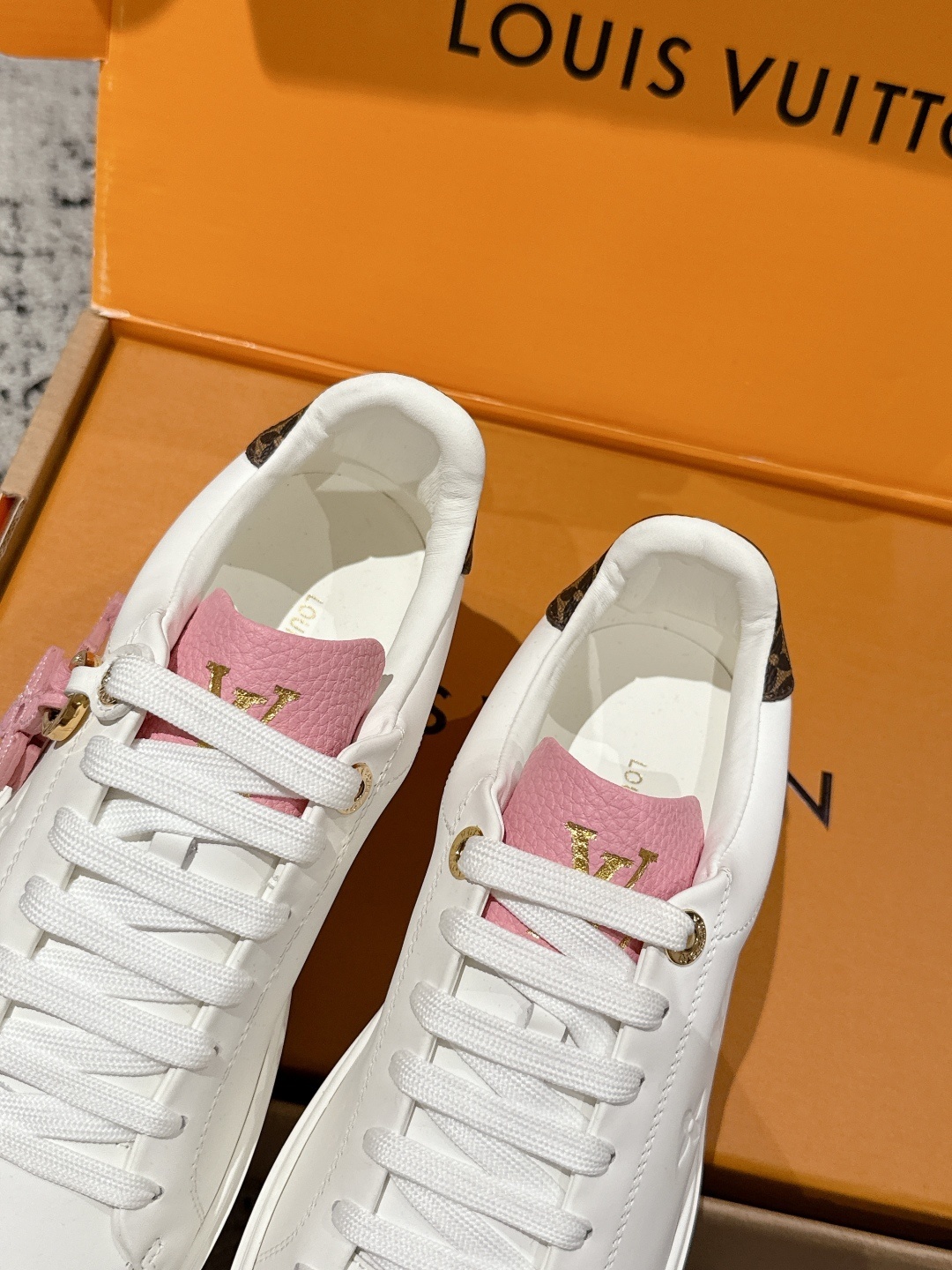 Louis Vuitton Women's White Leather Sneakers with Pink Accents