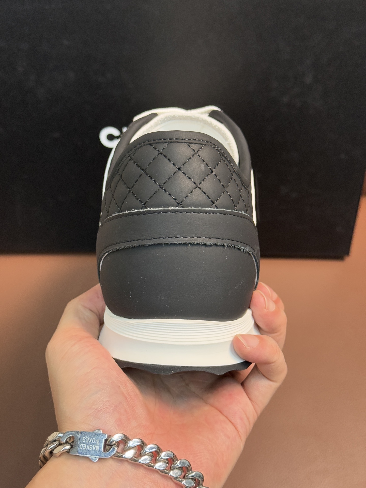 Chanel Luxury Black and White Leather Sneakers with Quilted Detail