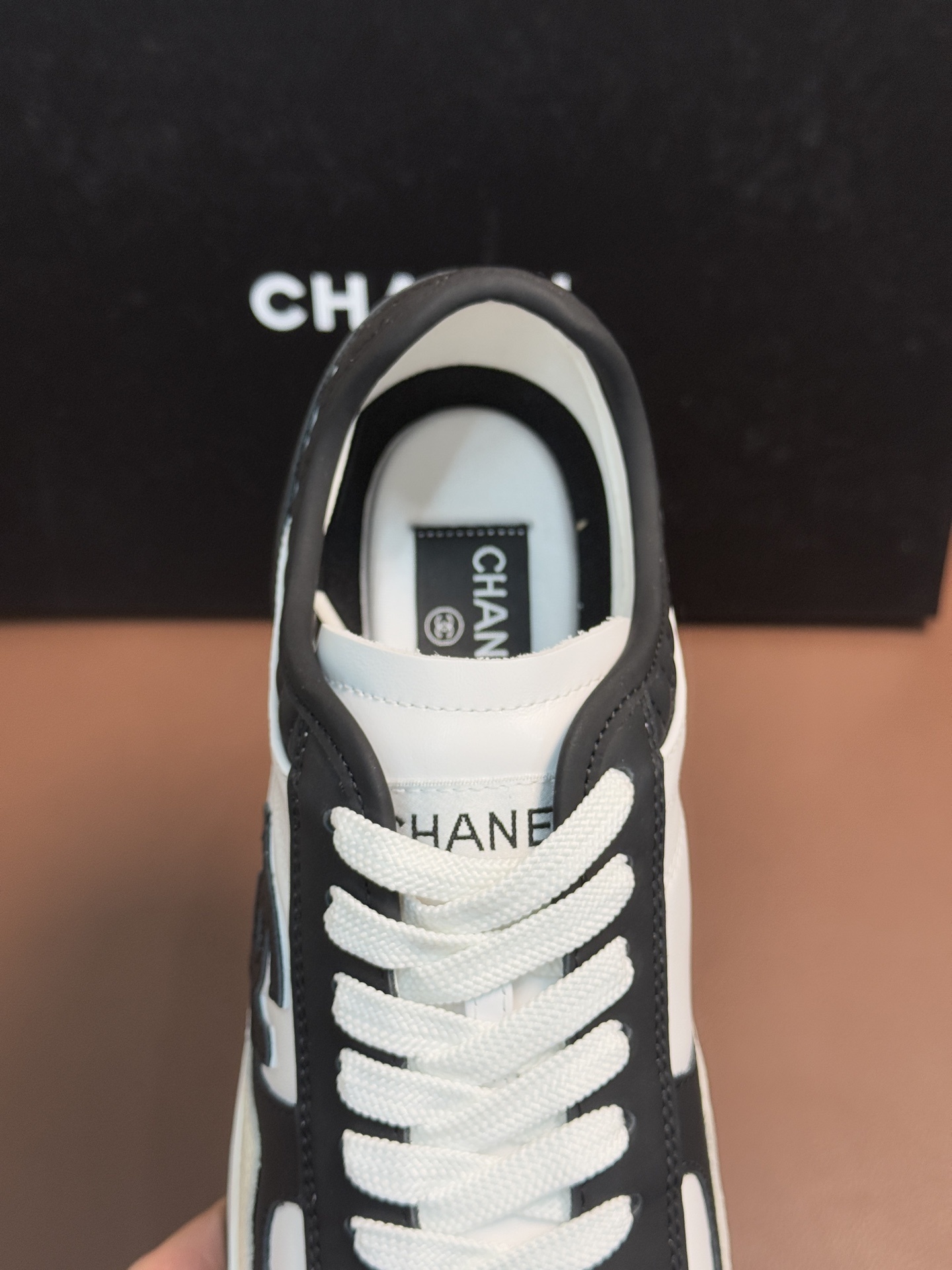 Chanel Luxury Black and White Leather Sneakers with Quilted Detail