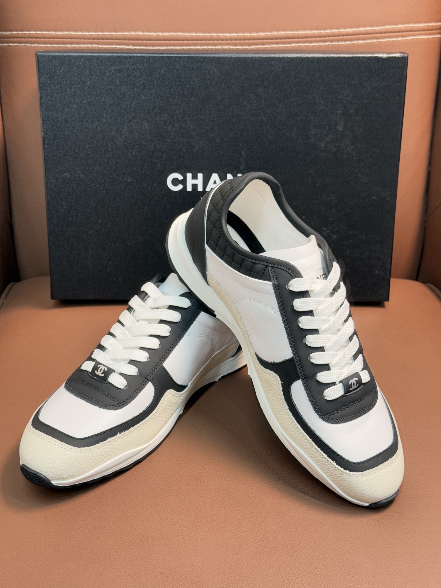 Chanel Luxury Black and White Leather Sneakers with Quilted Detail