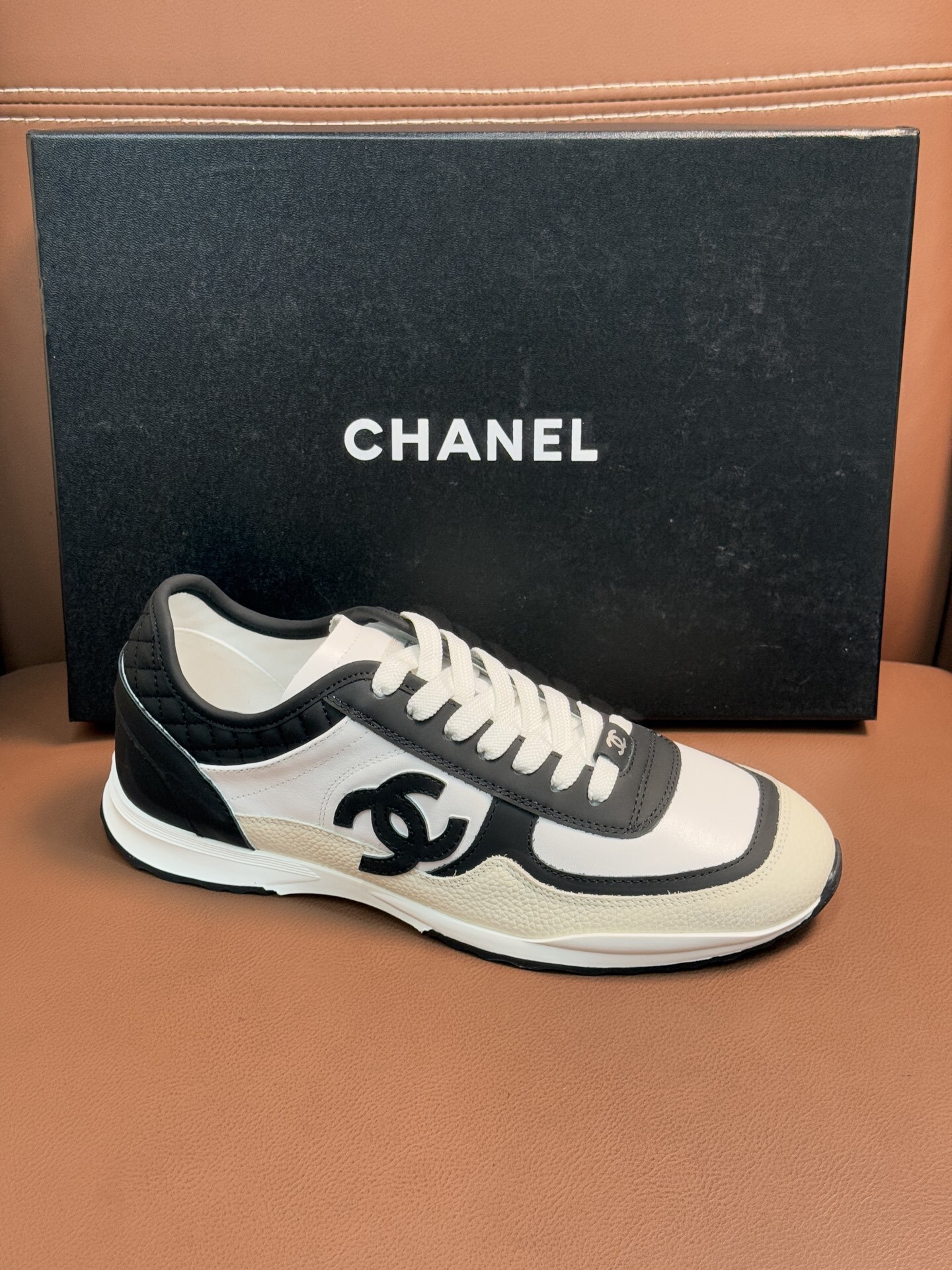 Chanel Luxury Black and White Leather Sneakers with Quilted Detail