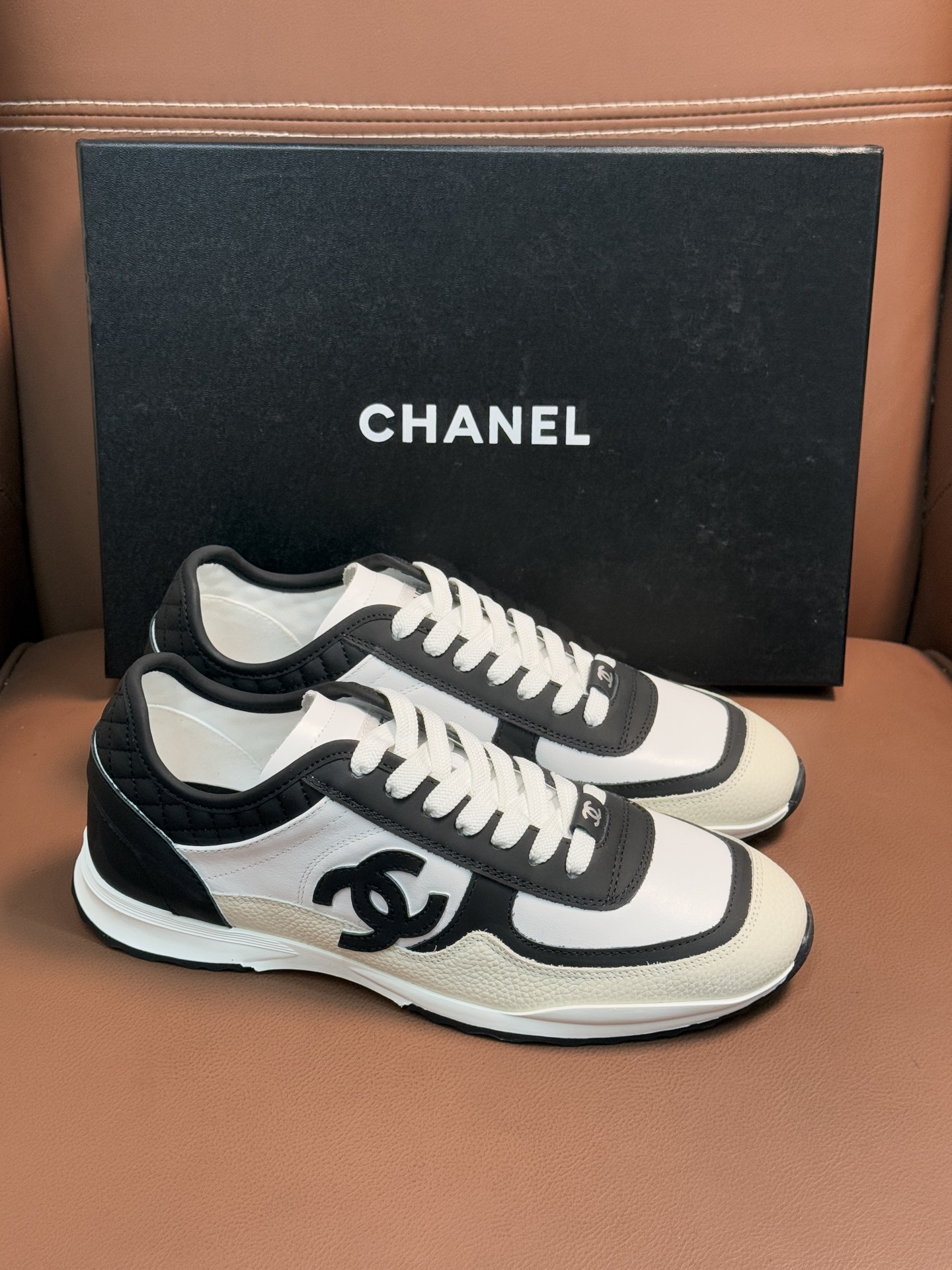 Chanel Luxury Black and White Leather Sneakers with Quilted Detail