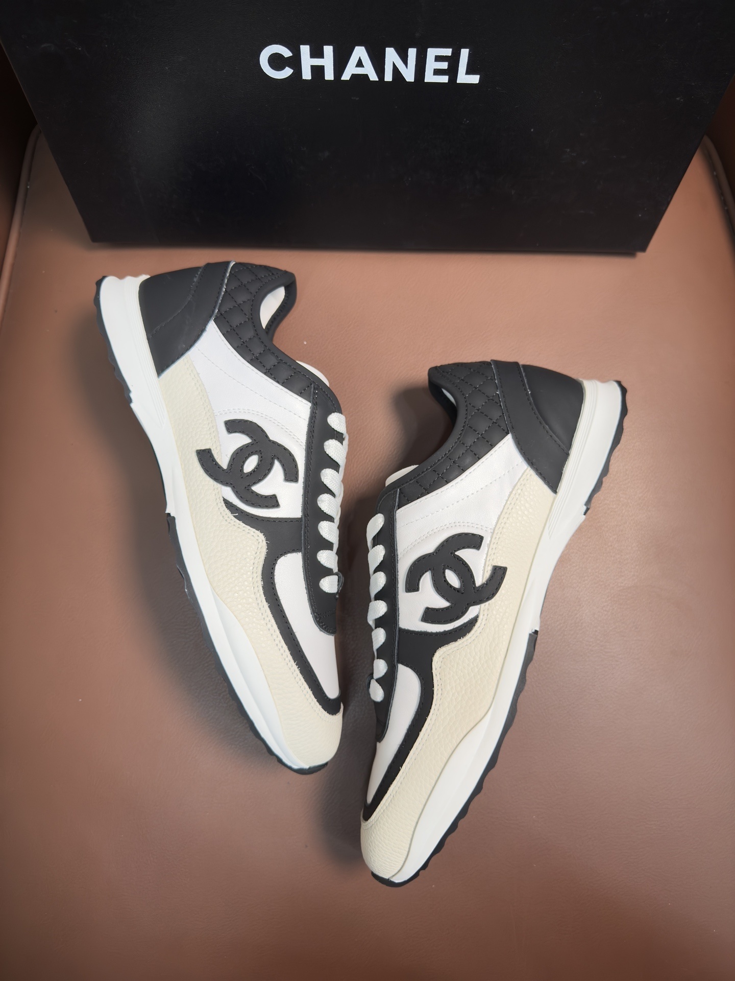 Chanel Luxury Black and White Leather Sneakers with Quilted Detail