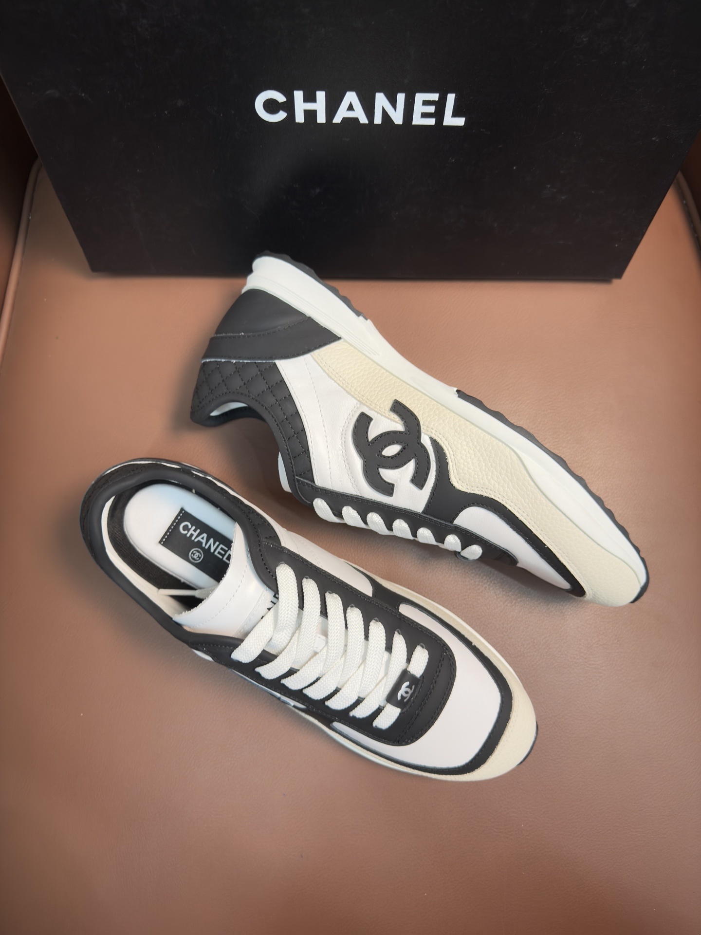 Chanel Luxury Black and White Leather Sneakers with Quilted Detail