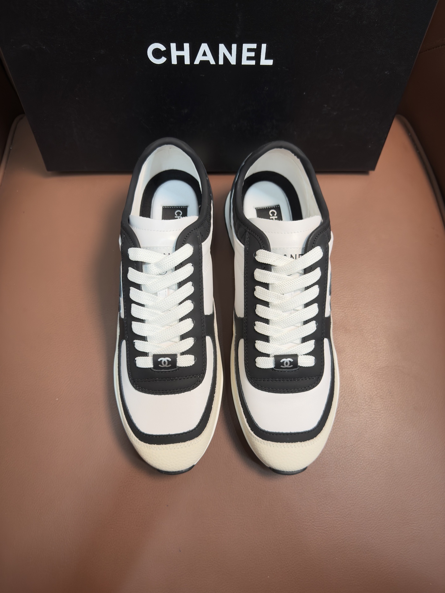 Chanel Luxury Black and White Leather Sneakers with Quilted Detail