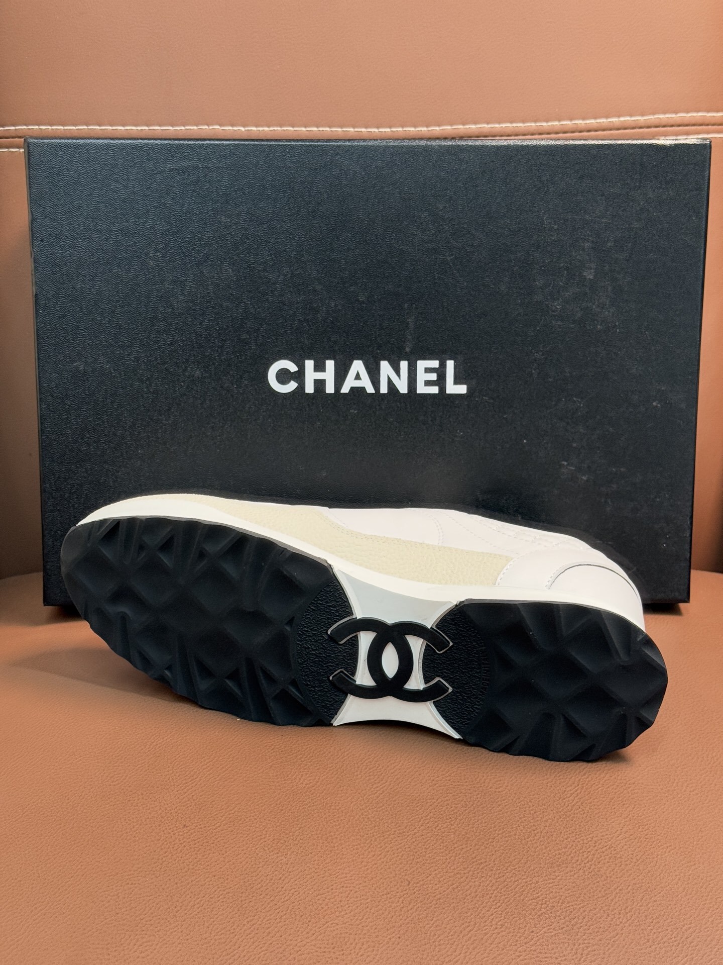 Chanel Luxury White Leather Sneakers with Black CC Logo Detail